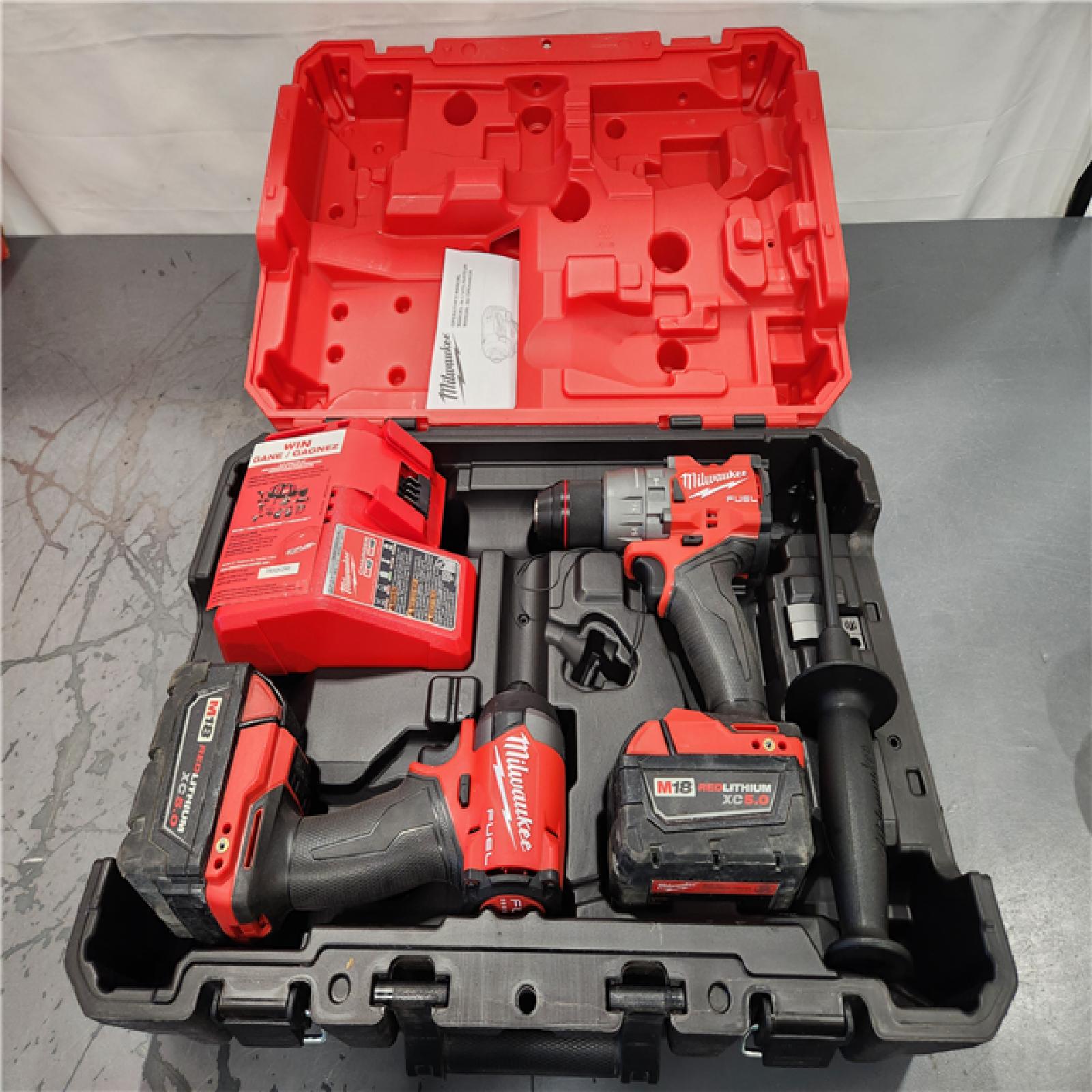 AS-IS- MILWAUKEE FUEL 18V Lithium-Ion Brushless Cordless Hammer Drill and Impact Driver Combo Kit