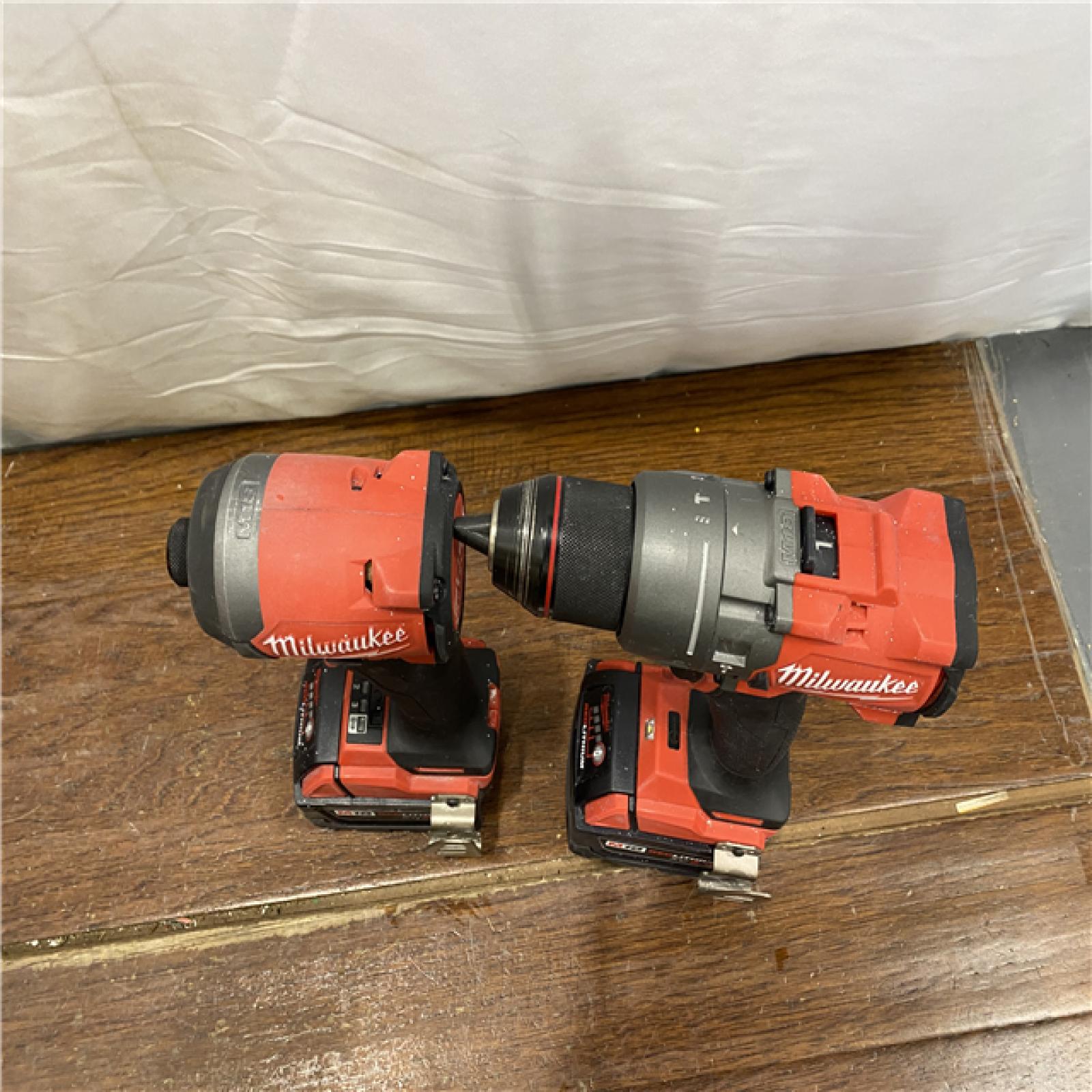 AS-IS MILWAUKEE M18 FUEL 18V Lithium-Ion Brushless Cordless Hammer Drill and Impact Driver Combo Kit (2-Tool) with 2 Batteries