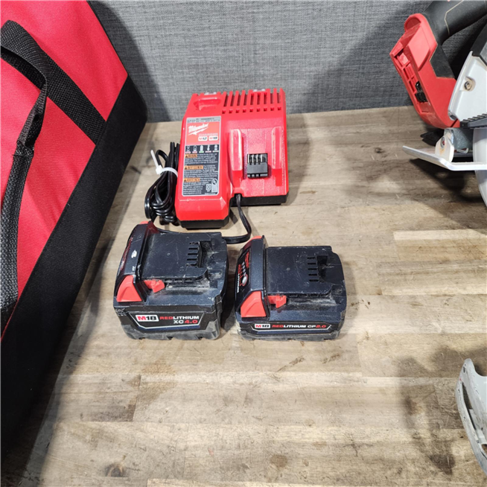 HOUSTON LOCATION - AS-IS Milwaukee M18 18-Volt Lithium-Ion Brushless Cordless Combo Kit (4-Tool) with 2-Batteries  1-Charger and Tool Bag