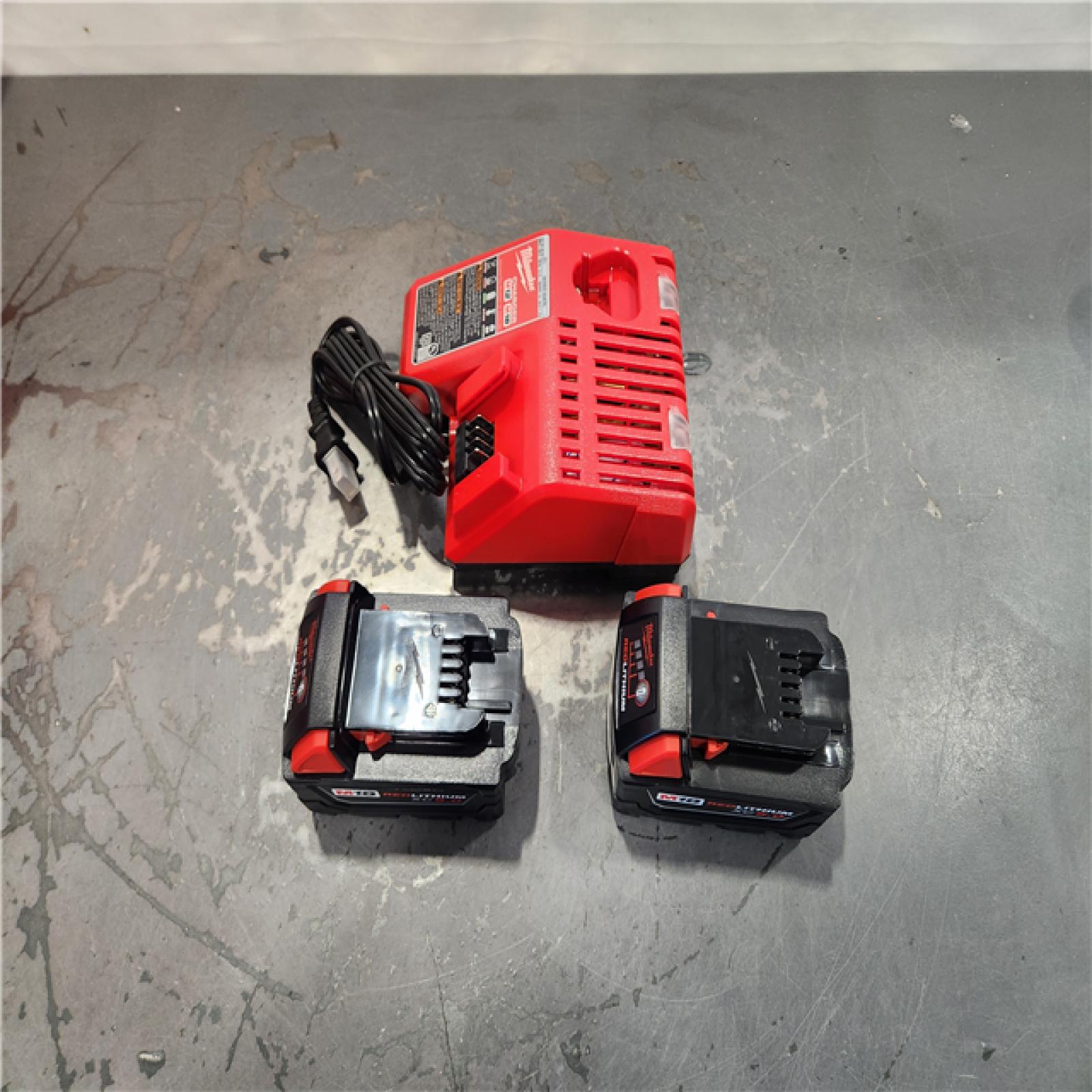 AS-IS- Milwaukee M18 18-Volt Lithium-Ion XC Starter Kit with Two 5.0Ah Batteries and Charger