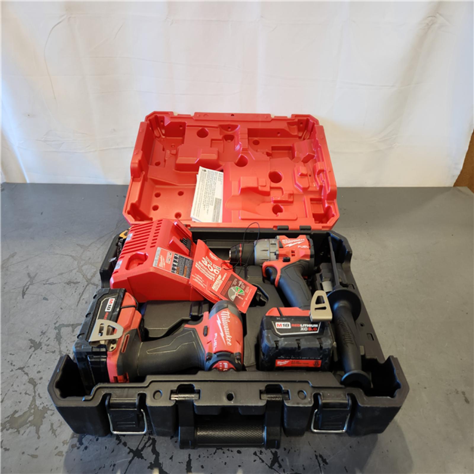 AS-IS- Milwaukee FUEL 18V Lithium-Ion Brushless Cordless Hammer Drill and Impact Driver Combo Kit