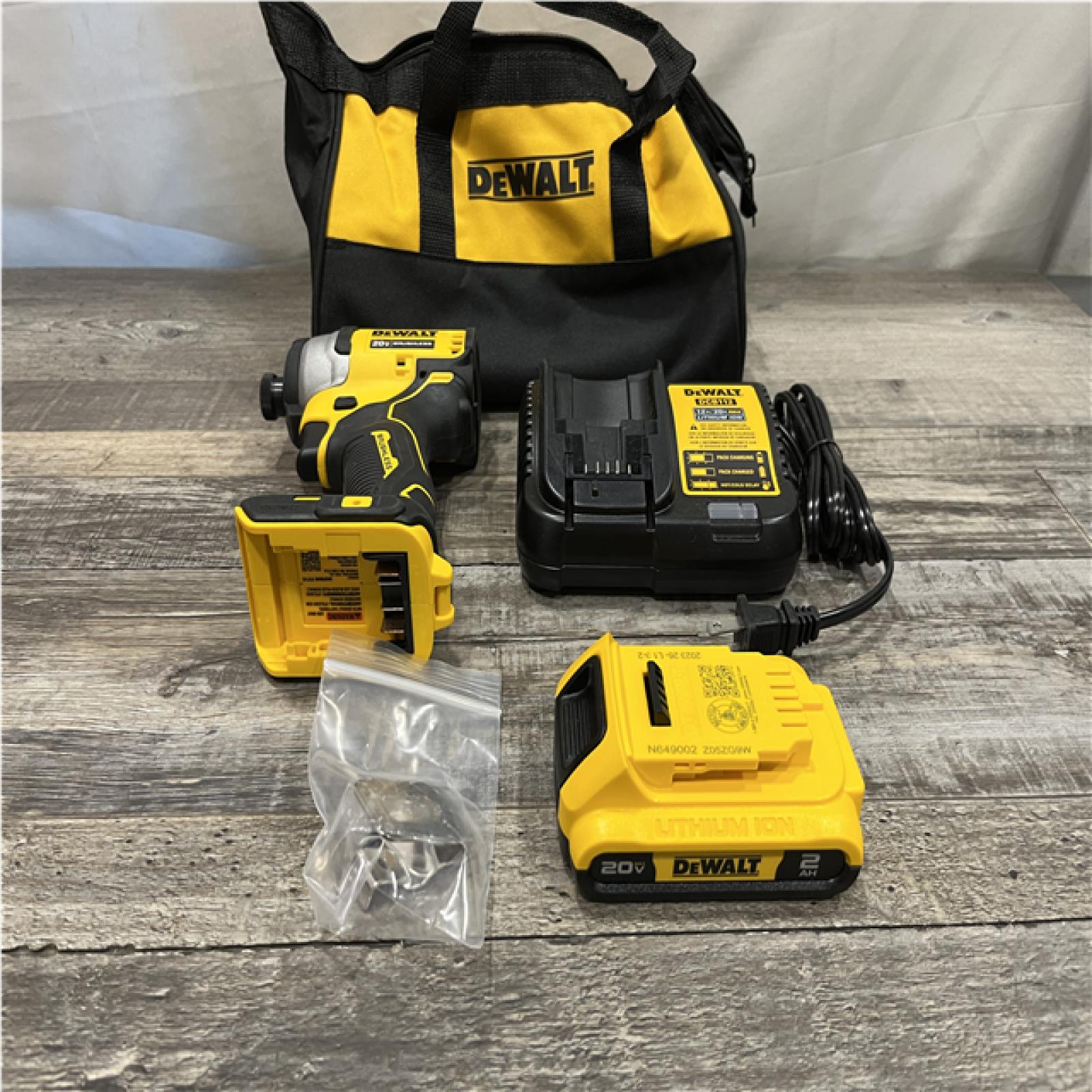 AS-IS DEWALT Atomic 20V Max Lithium-Ion Brushless Cordless Compact 1/4 in. Impact Driver Kit