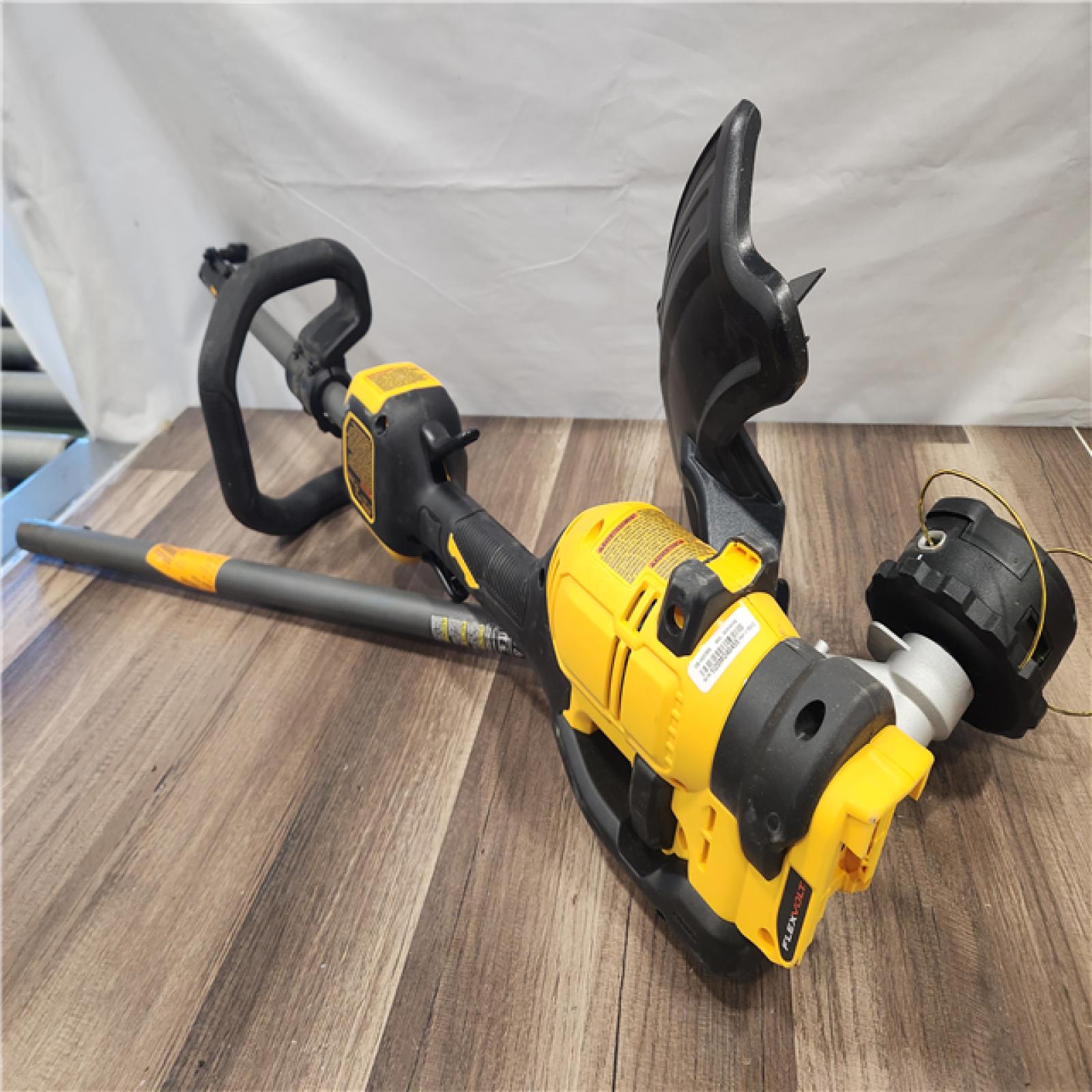 AS-IS- FLEXVOLT 60V MAX 17 in -trimmer with cordless attachment powered by a battery