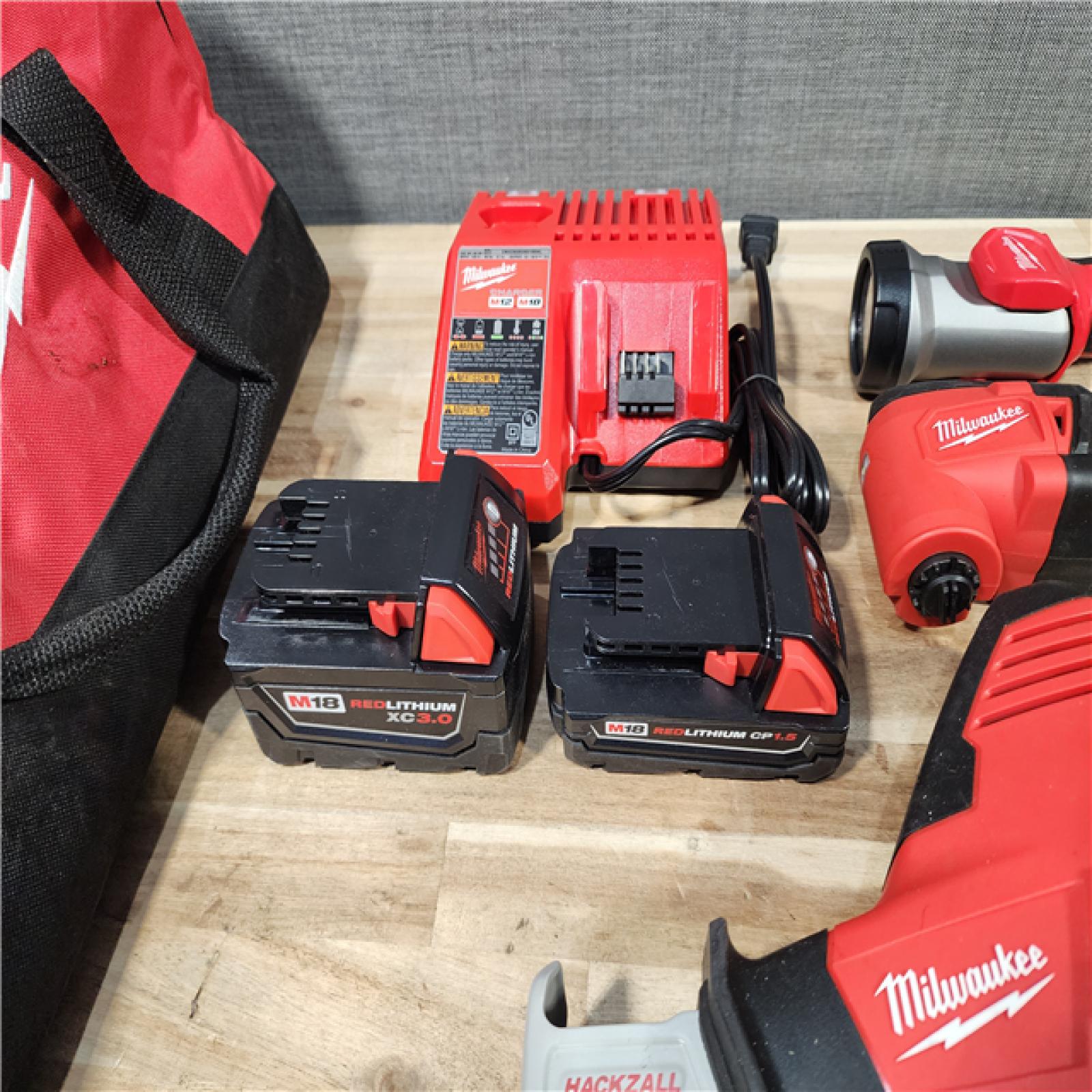 HOUSTON LOCATION - AS-IS MILWAUKEE 5 TOOL COMBO KIT W/ (2) BATTERY & CHARGER