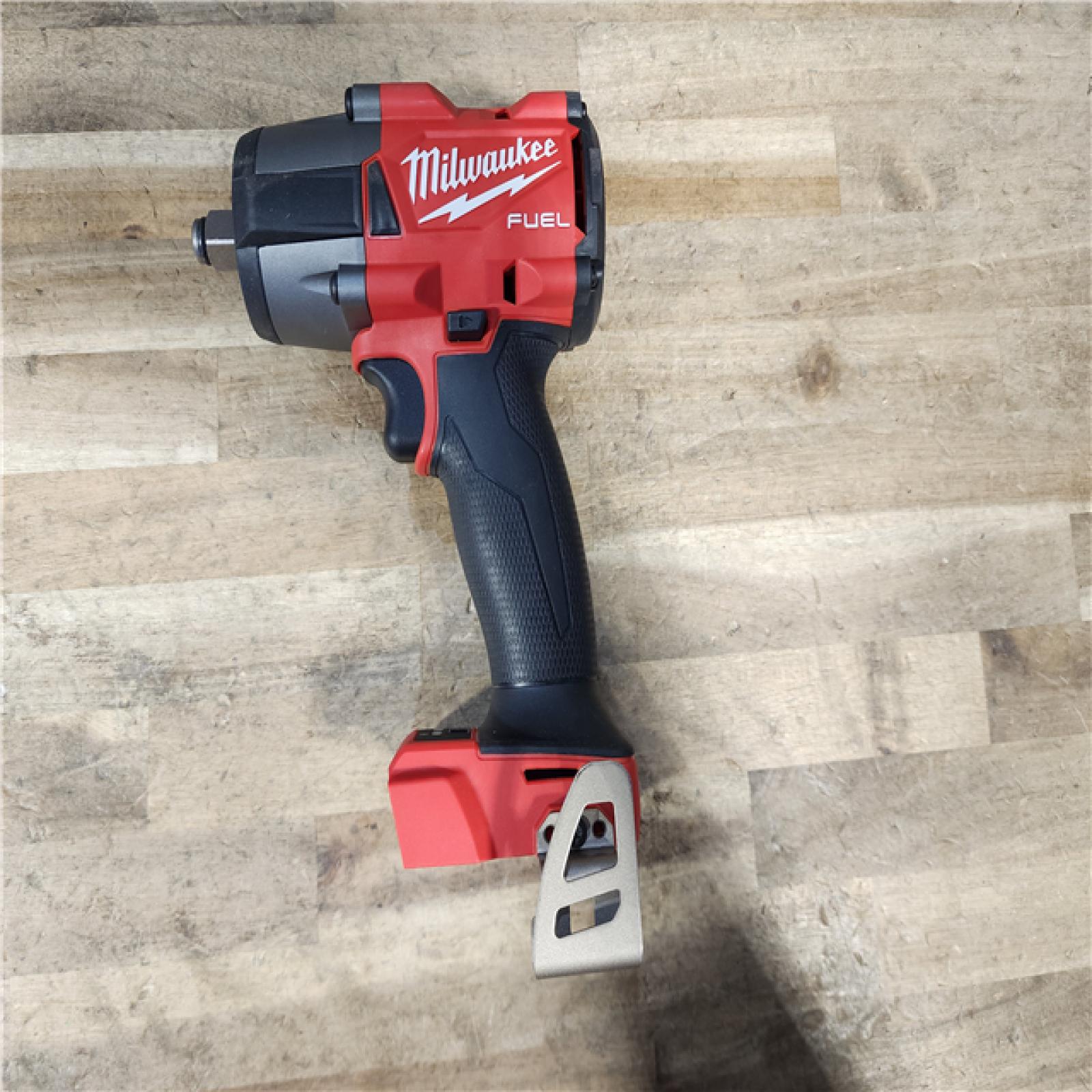 HOUSTON LOCATION - AS-IS Milwaukee M18 18V Fuel 1/2  Mid-Torque Impact Wrench Cordless Lithium-Ion Brushless with Friction Ring W/ BATTERY & CHARGER