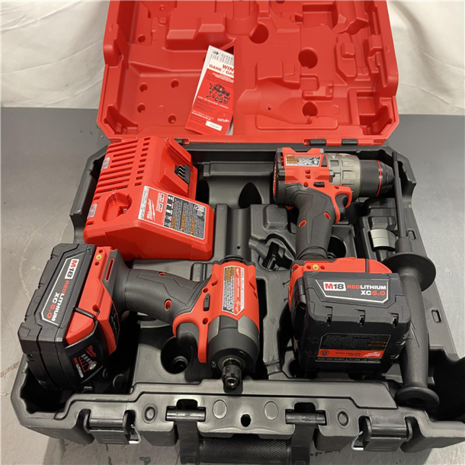 AS-IS - Milwaukee M18 FUEL 18V Lithium-Ion Brushless Cordless Hammer Drill and Impact Driver Combo Kit