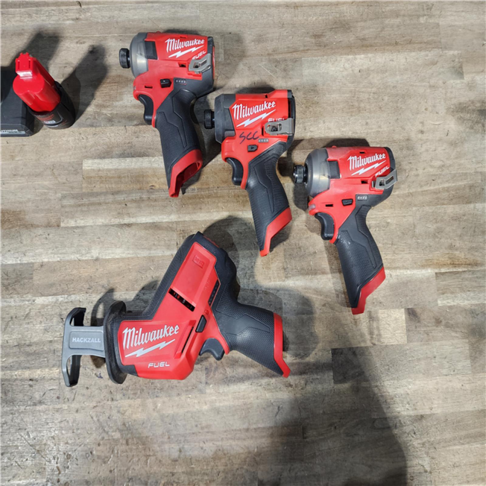 HOUSTON LOCATION - AS-IS MILWAUKEE 4 TOOL COMBO KIT W/ (2) BATTERY & CHARGER