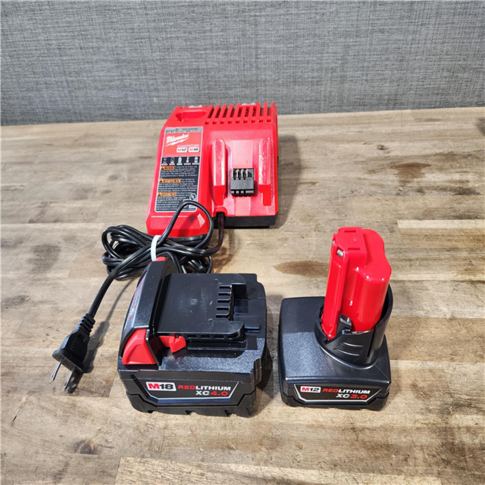 HOUSTON LOCATION - AS-IS MILWAUKEE 4 TOOL COMBO KIT W/ (2) BATTERY & CHARGER