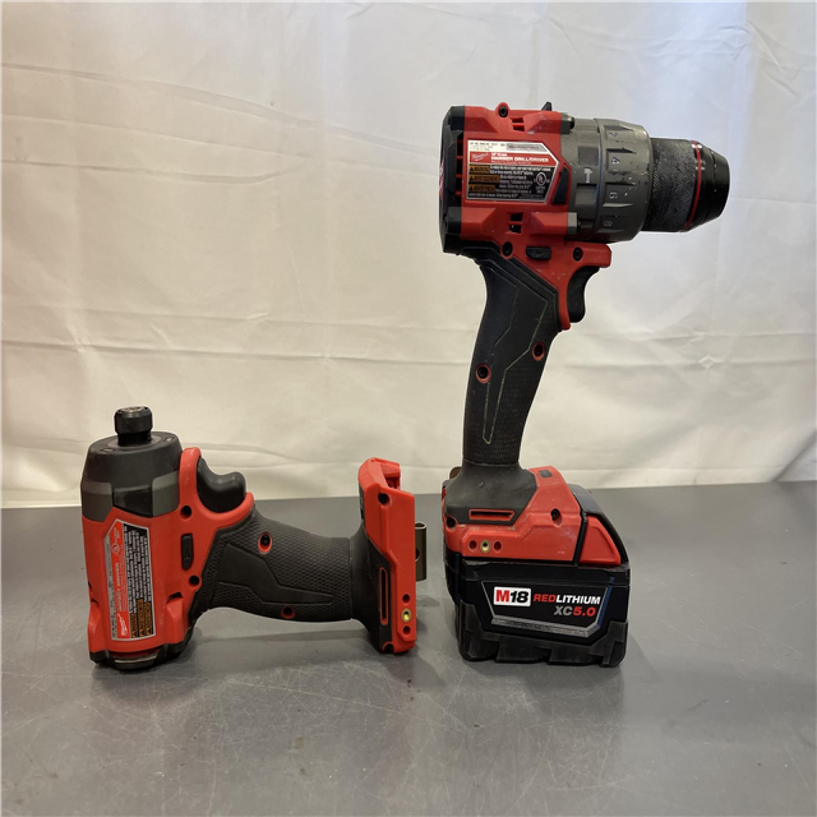 AS-IS - MILWAUKEE FUEL 18V Lithium-Ion Brushless Cordless Hammer Drill and Impact Driver Combo Kit