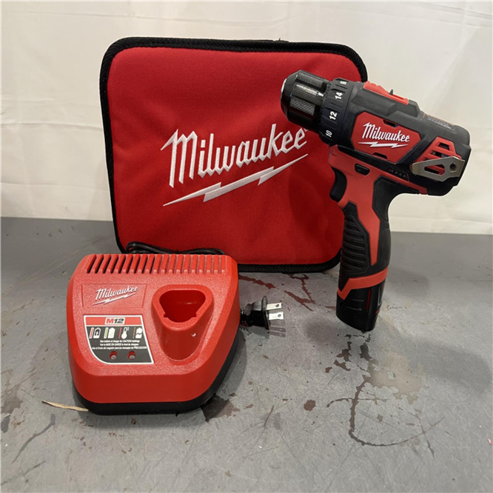 AS-IS - MILWAUKEE M12 12V Lithium-Ion Cordless 3/8 in. Drill/Driver Kit with Two 1.5 Ah Batteries, Charger and Tool Bag