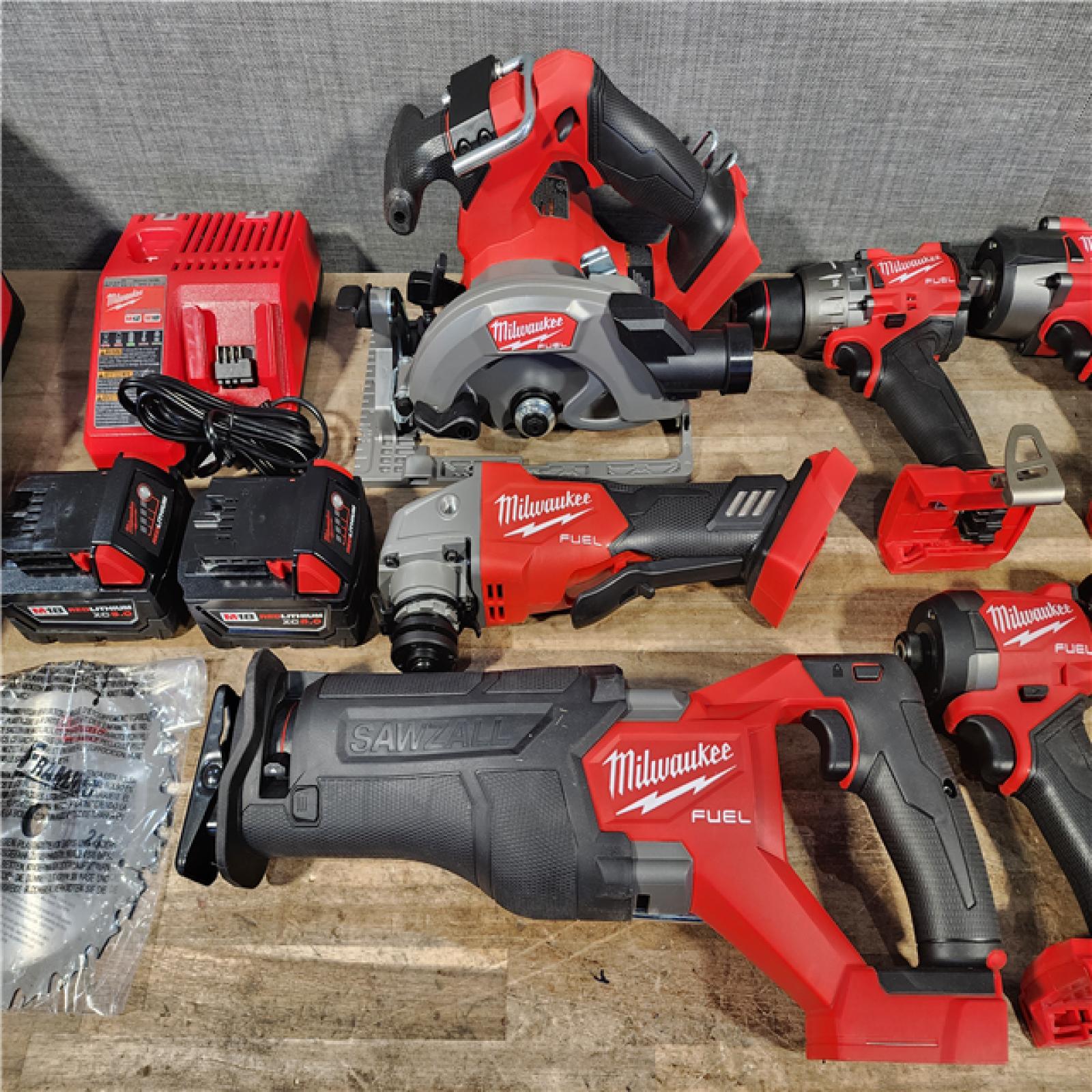 HOUSTON LOCATION - AS-IS Milwaukee M18 FUEL 18V Lithium-Ion Brushless Cordless Combo Kit with Two 5.0 Ah Batteries  1 Charger  2 Tool Bags (7-Tool)