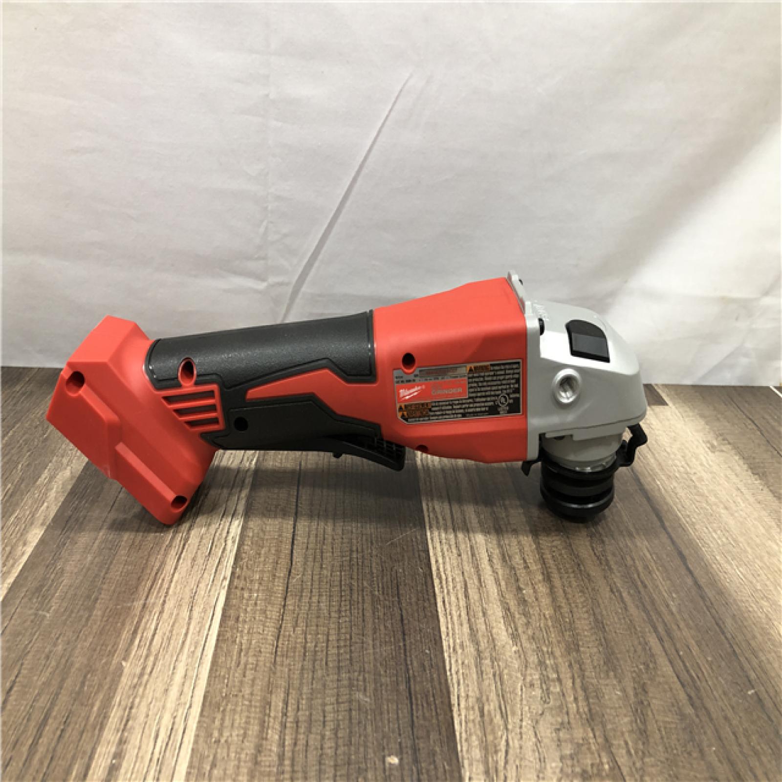 AS-IS Milwaukee 18V Lithium-Ion Brushless Cordless 4-1/2 in./5 in. Grinder w/Paddle Switch (Tool-Only)