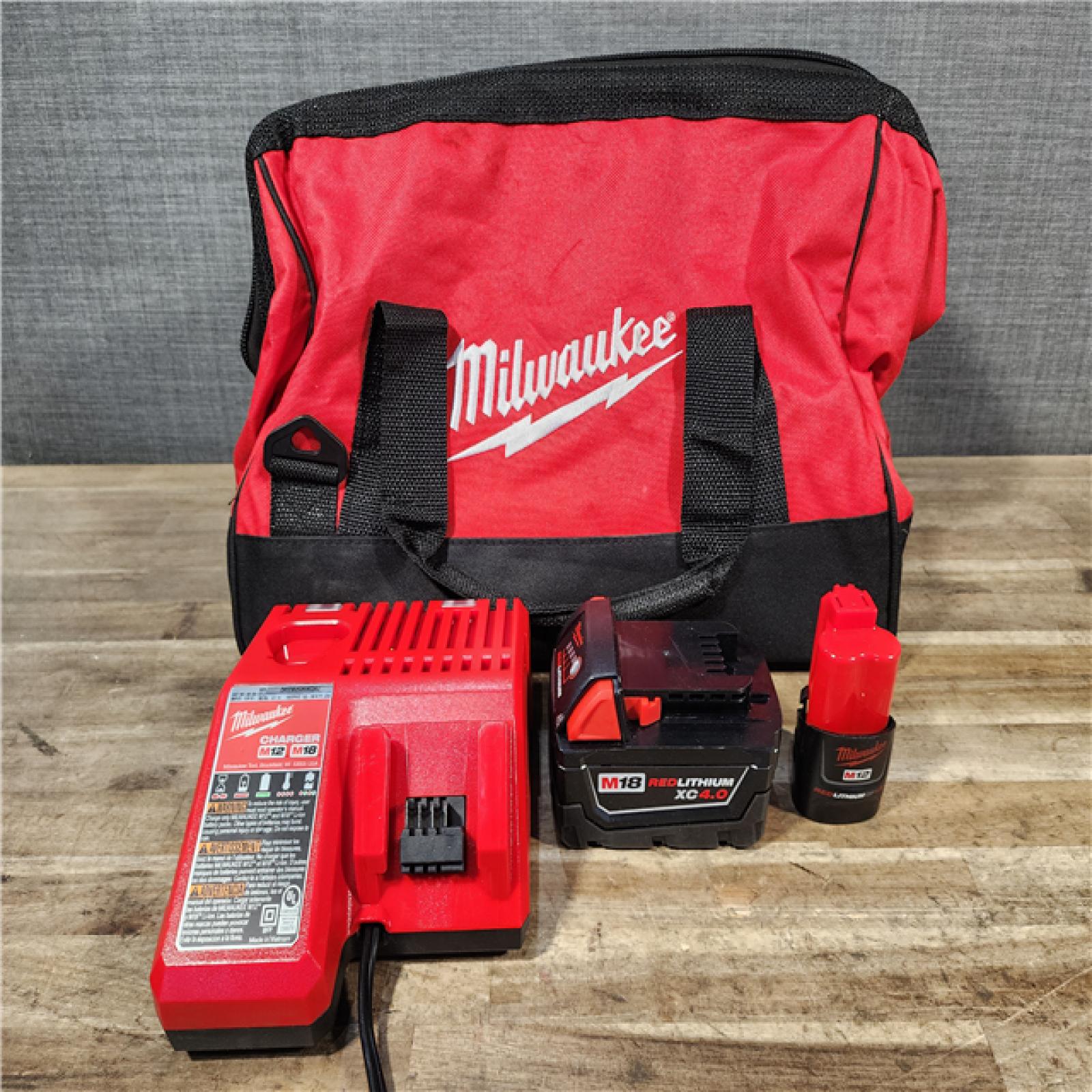 HOUSTON LOCATION - AS-IS Milwaukee 12/18V Lithium-Ion Cordless 3/8 in. Ratchet and 1/2 in. High Torque Impact Wrench with Friction Ring Combo Kit