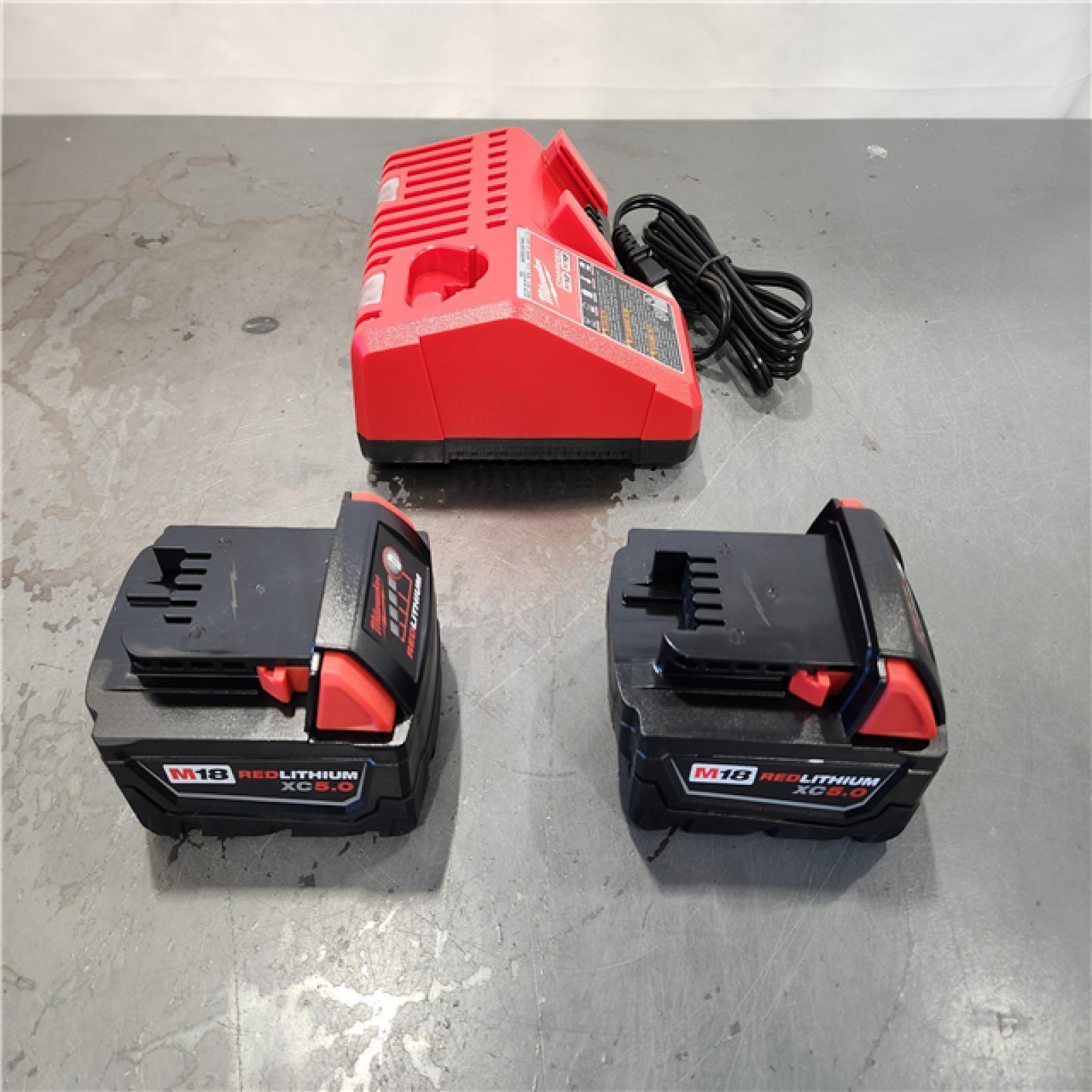 AS-IS- Milwaukee M18 18-Volt Lithium-Ion XC Starter Kit with Two 5.0Ah Batteries and Charger