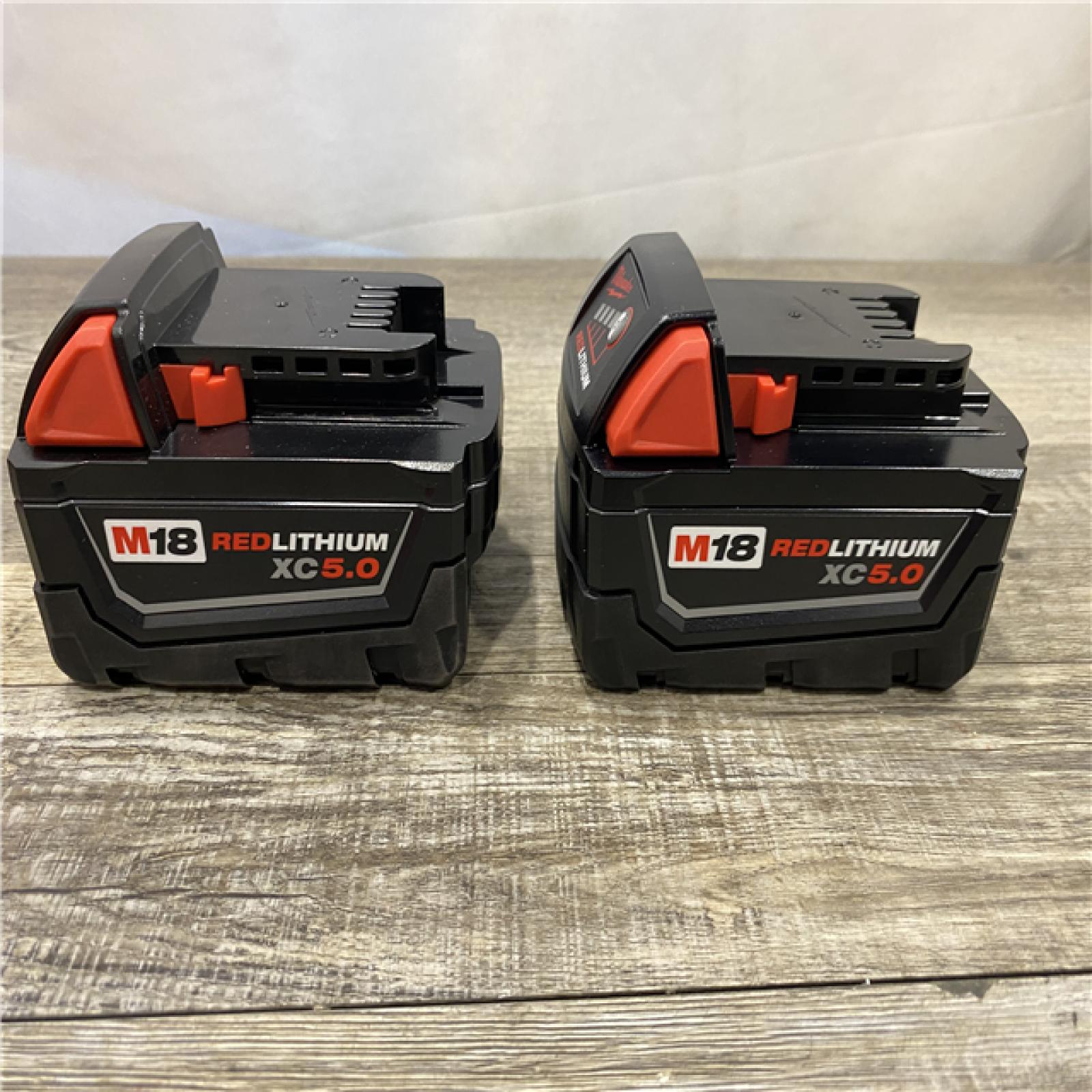 AS-IS Milwaukee 18-Volt Lithium-Ion XC Starter Kit with Two 5.0Ah Batteries and Charger