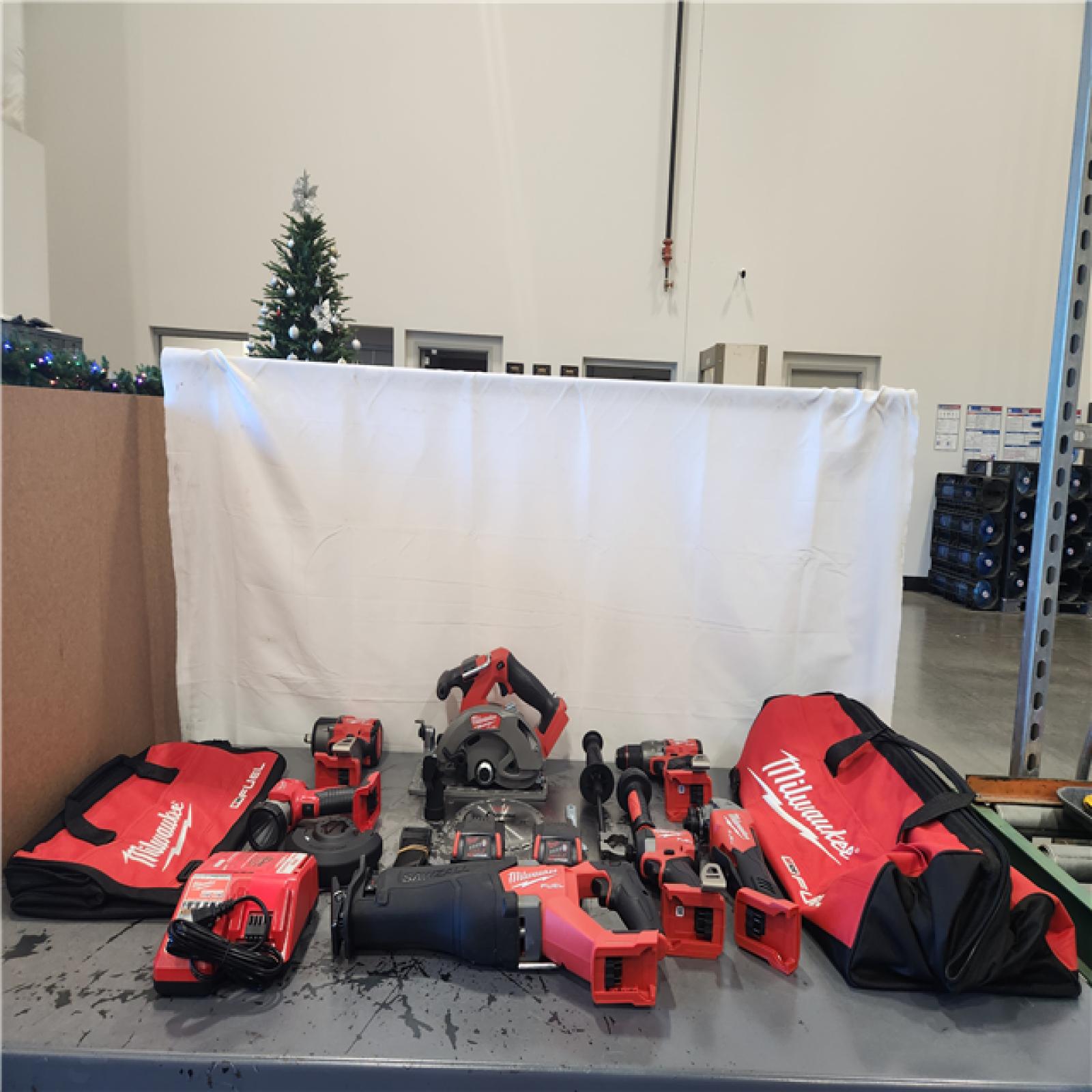 AS-IS- Milwaukee M18 FUEL 18V Lithium-Ion Brushless Cordless Combo Kit with Two 5.0 Ah Batteries  1 Charger  2 Tool Bags (7-Tool)