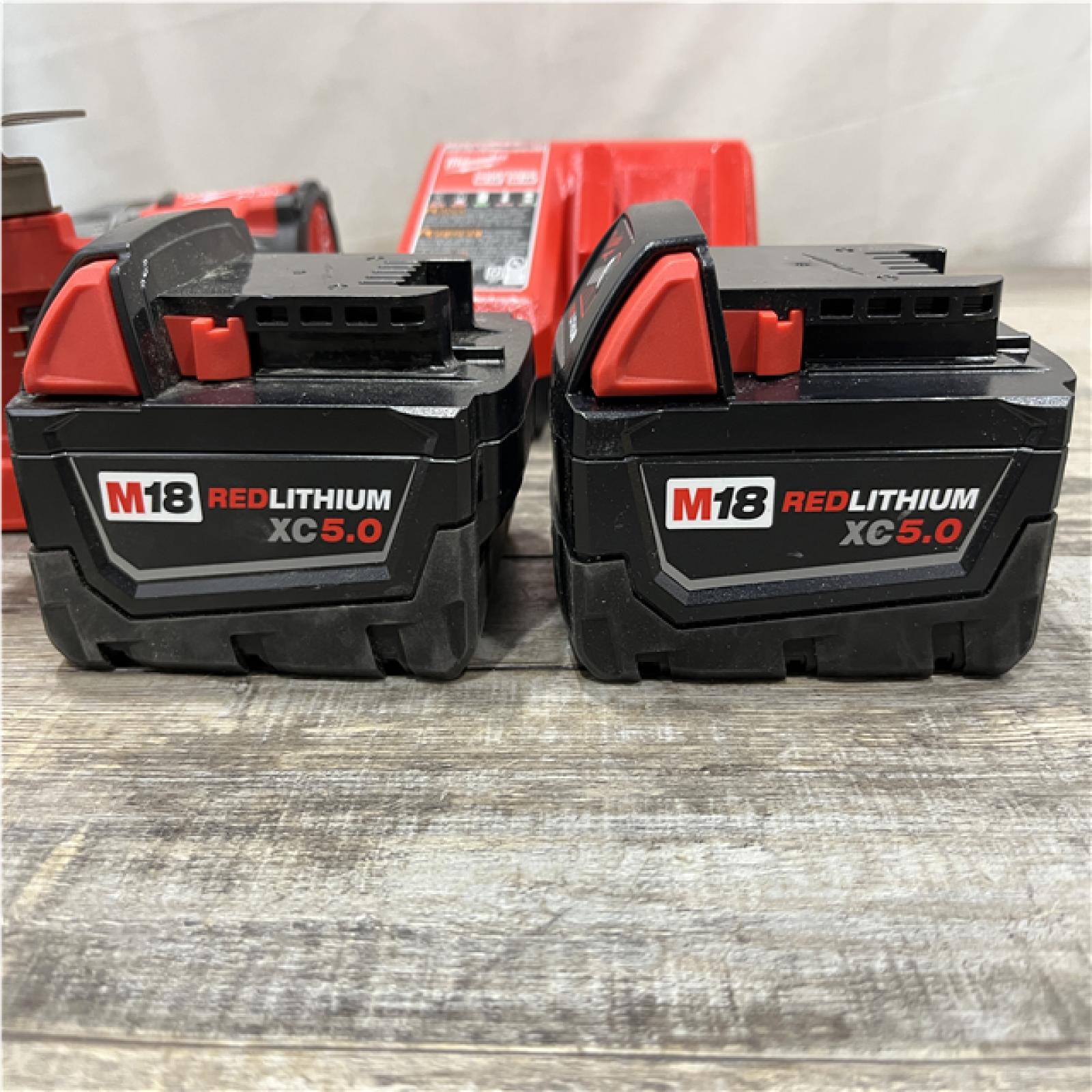 AS-IS Milwaukee FUEL 18V Lithium-Ion Brushless Cordless 1/2 in. Hammer Drill Driver Kit