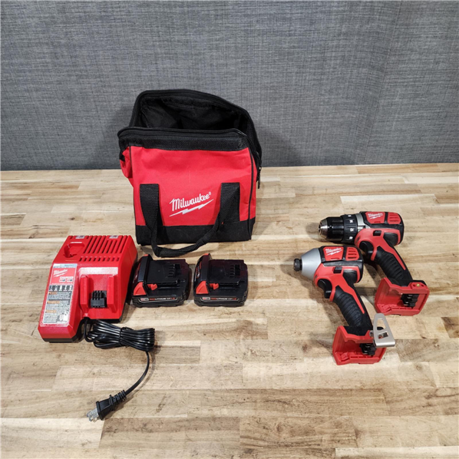 HOUSTON LOCATION - AS-IS Milwaukee M18 18V Lithium-Ion Cordless Drill Driver/Impact Driver Combo Kit