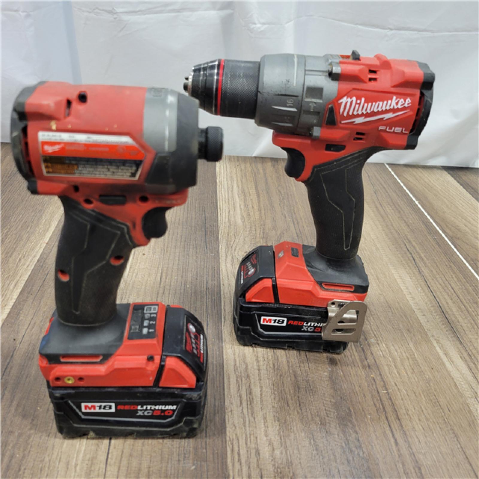 AS-IS MILWAUKEE M18 FUEL 18V Lithium-Ion Brushless Cordless Hammer Drill and Impact Driver Combo Kit (2-Tool) with 2 Batteries