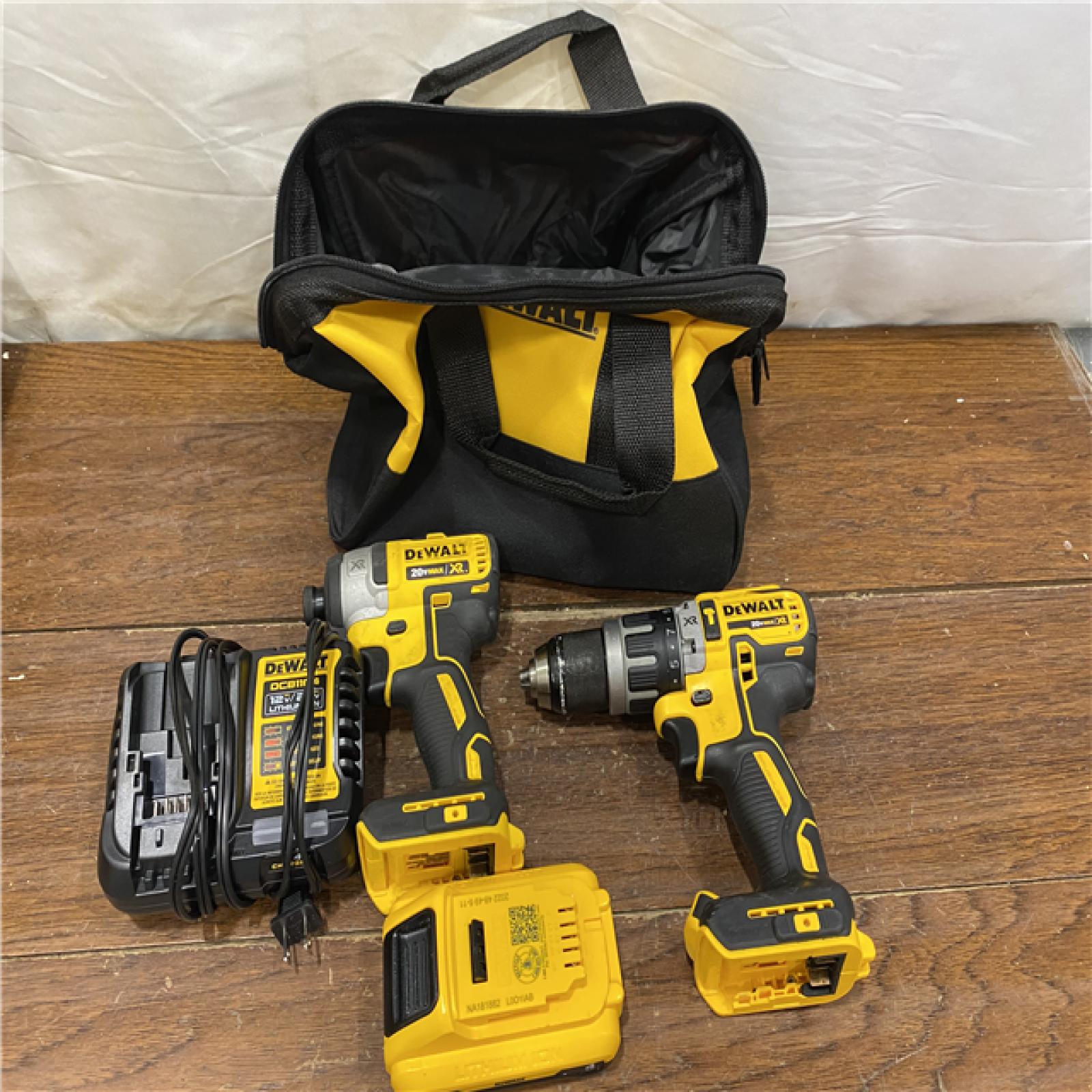 AS-IS DEWALT 20V MAX XR Hammer Drill and ATOMIC Impact Driver 2 Tool Cordless Combo Kit with (2) 4.0Ah Batteries, Charger, and Bag