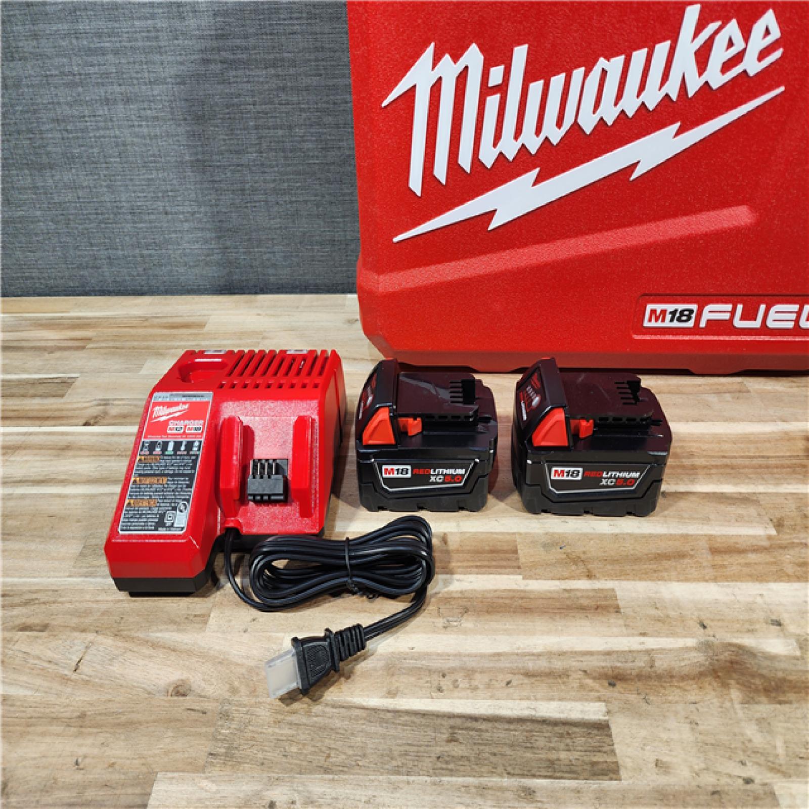 HOUSTON LOCATION - AS-IS (APPEARS LIKE NEW) Milwaukee  FUEL 18V Lithium-Ion Brushless Cordless Hammer Drill and Impact Driver Combo Kit