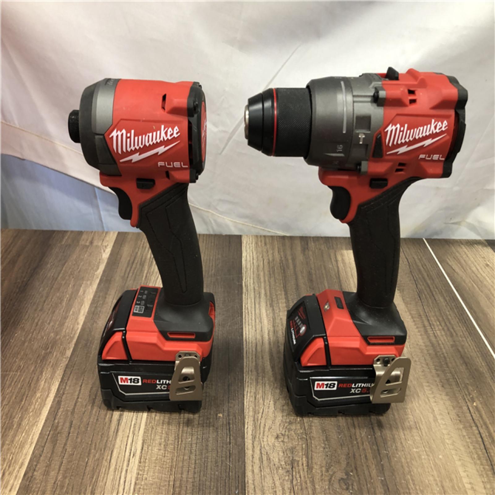 AS-IS Milwaukee FUEL 18V Lithium-Ion Brushless Cordless Hammer Drill and Impact Driver Combo Kit