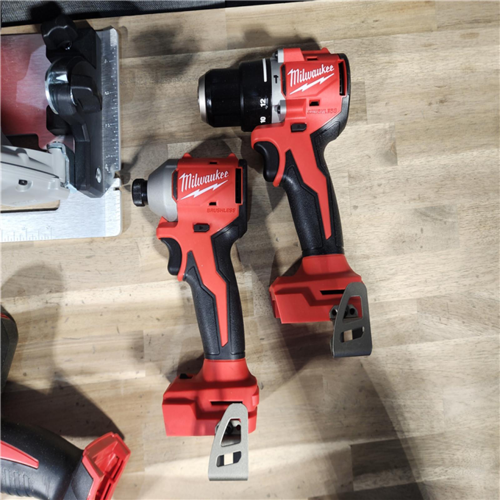 HOUSTON LOCATION - AS-IS Milwaukee M18 18-Volt Lithium-Ion Brushless Cordless Combo Kit (4-Tool) with 2-Batteries, 1-Charger and Tool Bag