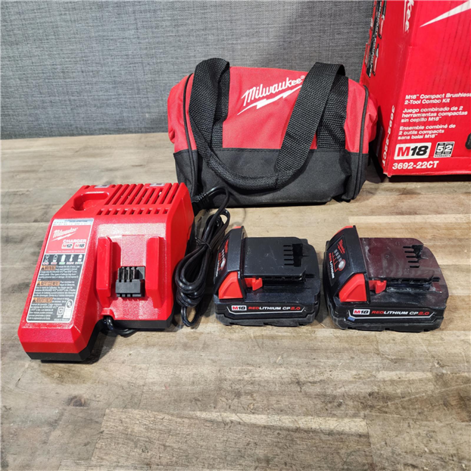 HOUSTON LOCATION - AS-IS Milwaukee M18 18V Lithium-Ion Brushless Cordless Compact Drill/Impact Combo Kit (2-Tool) W/(2) 2.0 Ah Batteries  Charger & Bag