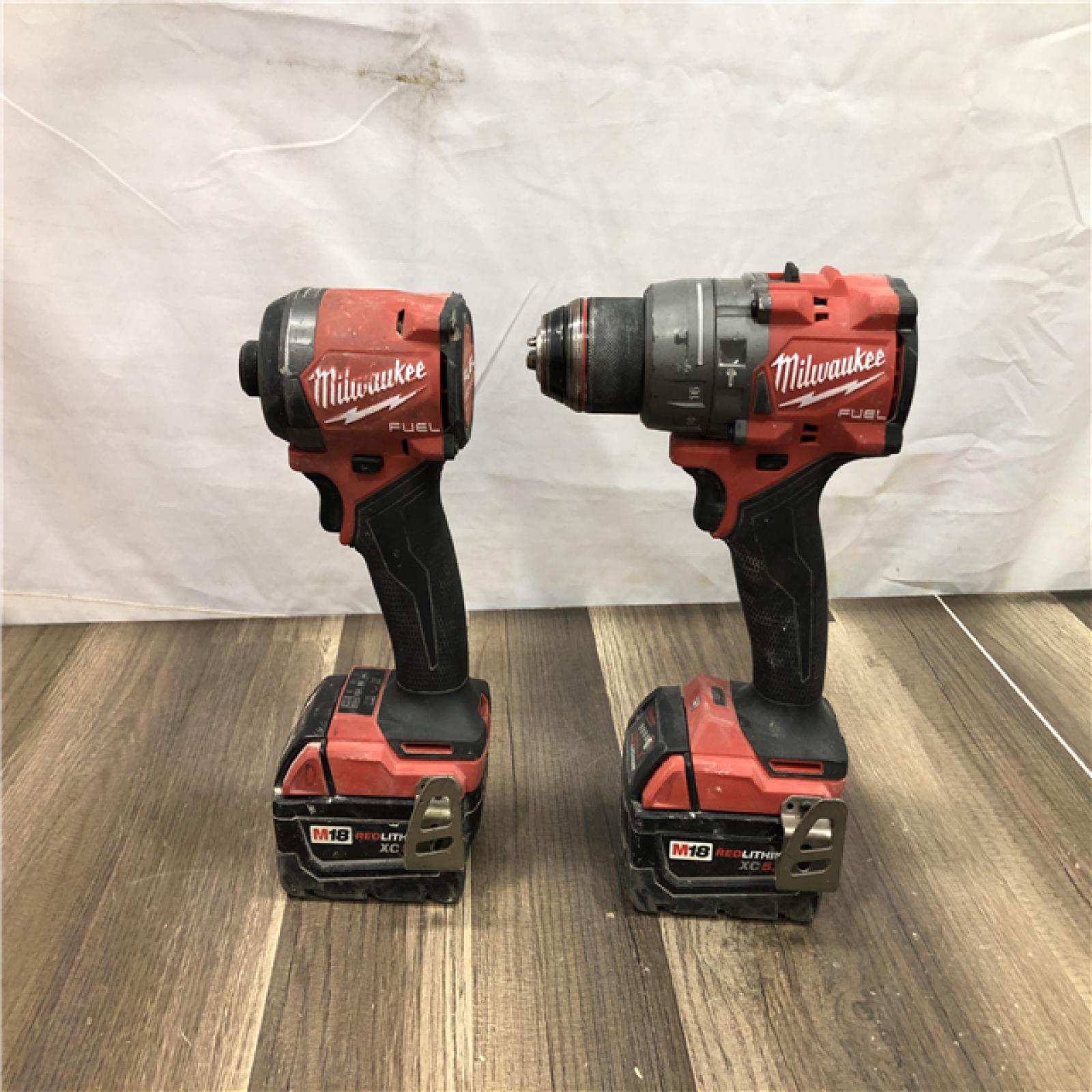 AS-IS Milwaukee FUEL 18V Lithium-Ion Brushless Cordless Hammer Drill and Impact Driver Combo Kit