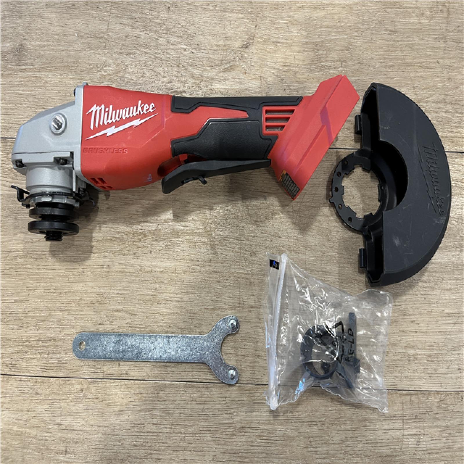 AS-IS Milwaukee 18V Lithium-Ion Brushless Cordless 4-1/2 in./5 in. Grinder w/Paddle Switch (Tool-Only)