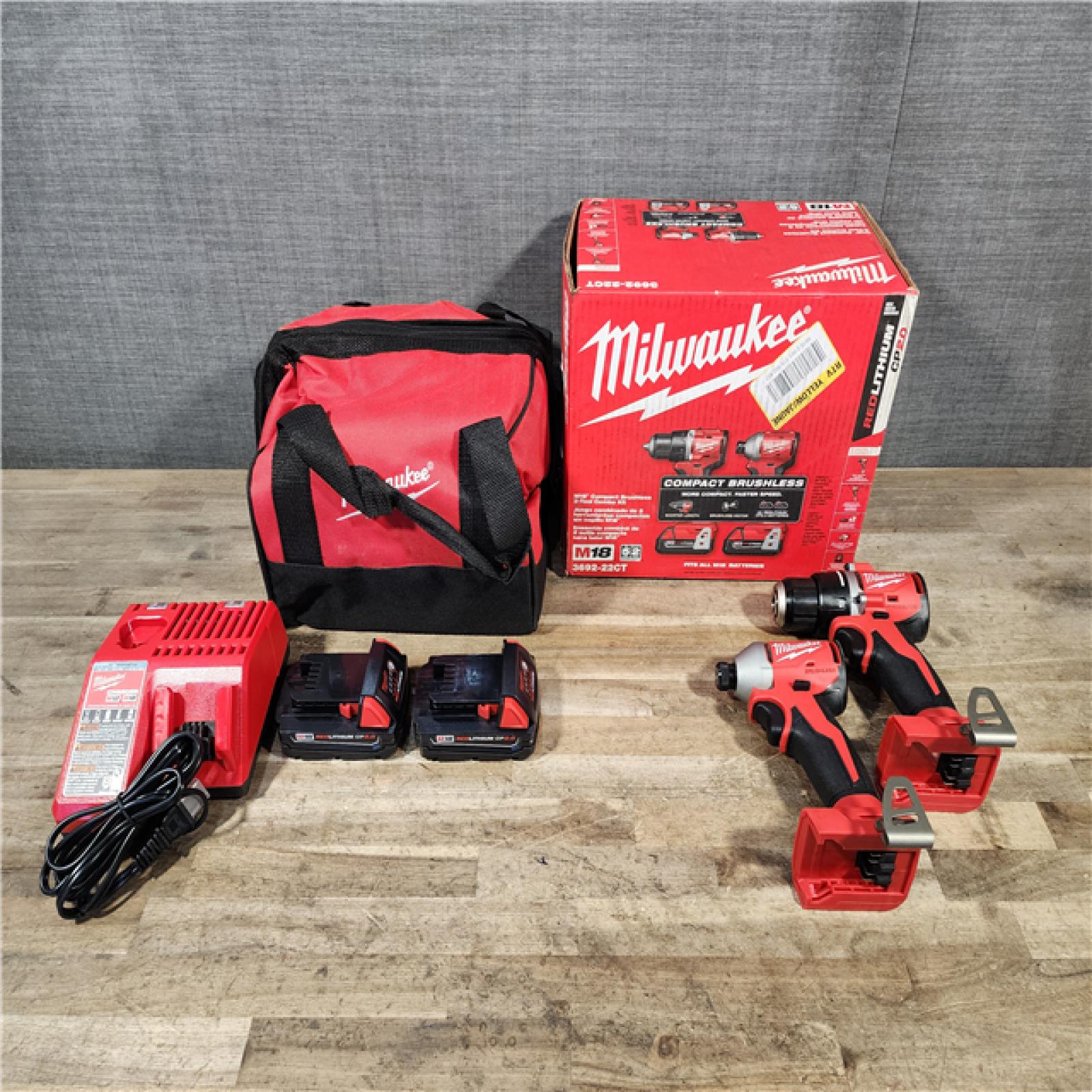 HOUSTON LOCATION - AS-IS Milwaukee M18 18V Lithium-Ion Brushless Cordless Compact Drill/Impact Combo Kit (2-Tool) W/(2) 2.0 Ah Batteries  Charger & Bag