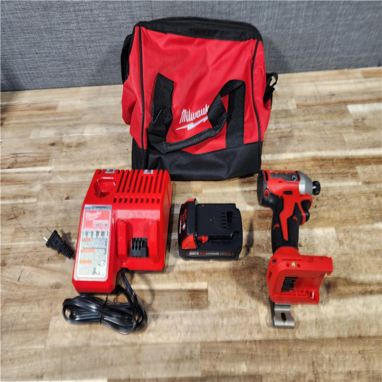 HOUSTON LOCATION - AS - IS Milwaukee 18-Volt Lithium-Ion Compact Brushless Cordless 1/4 in. Impact Driver Kit