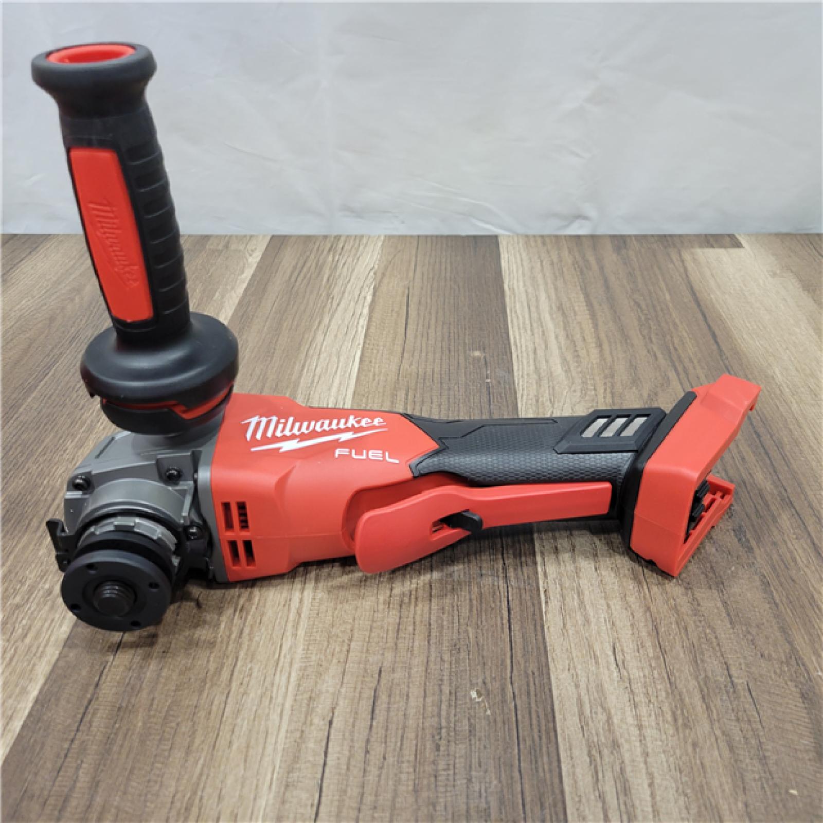 AS-IS Milwaukee  M18 FUEL 18-Volt Lithium-Ion Brushless Cordless 4-1/2 in./5 in. Grinder W/Paddle Switch (Tool-Only)