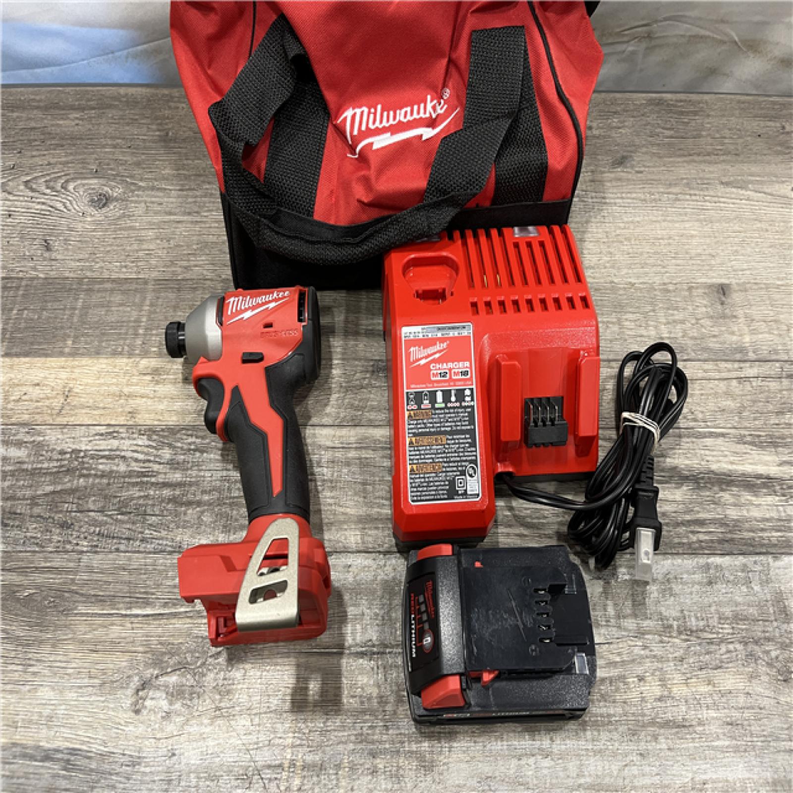 AS-IS Milwaukee 18-Volt Lithium-Ion Compact Brushless Cordless 1/4 in. Impact Driver Kit