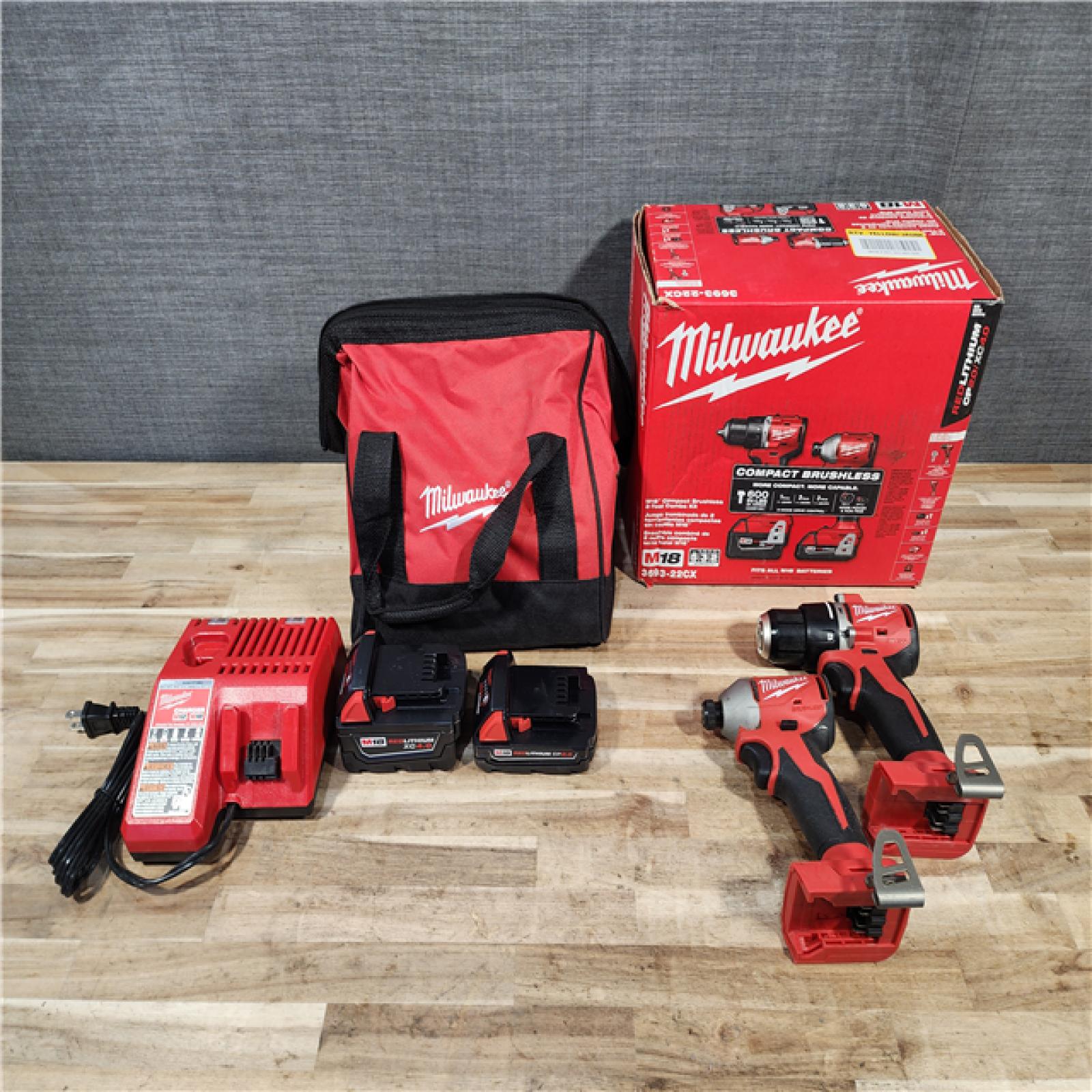 HOUSTON LOCATION - AS-IS M18 18-Volt Lithium-Ion Brushless Cordless Compact Hammer Drill/Impact Combo Kit (2-Tool) with (2) Batteries  Bag