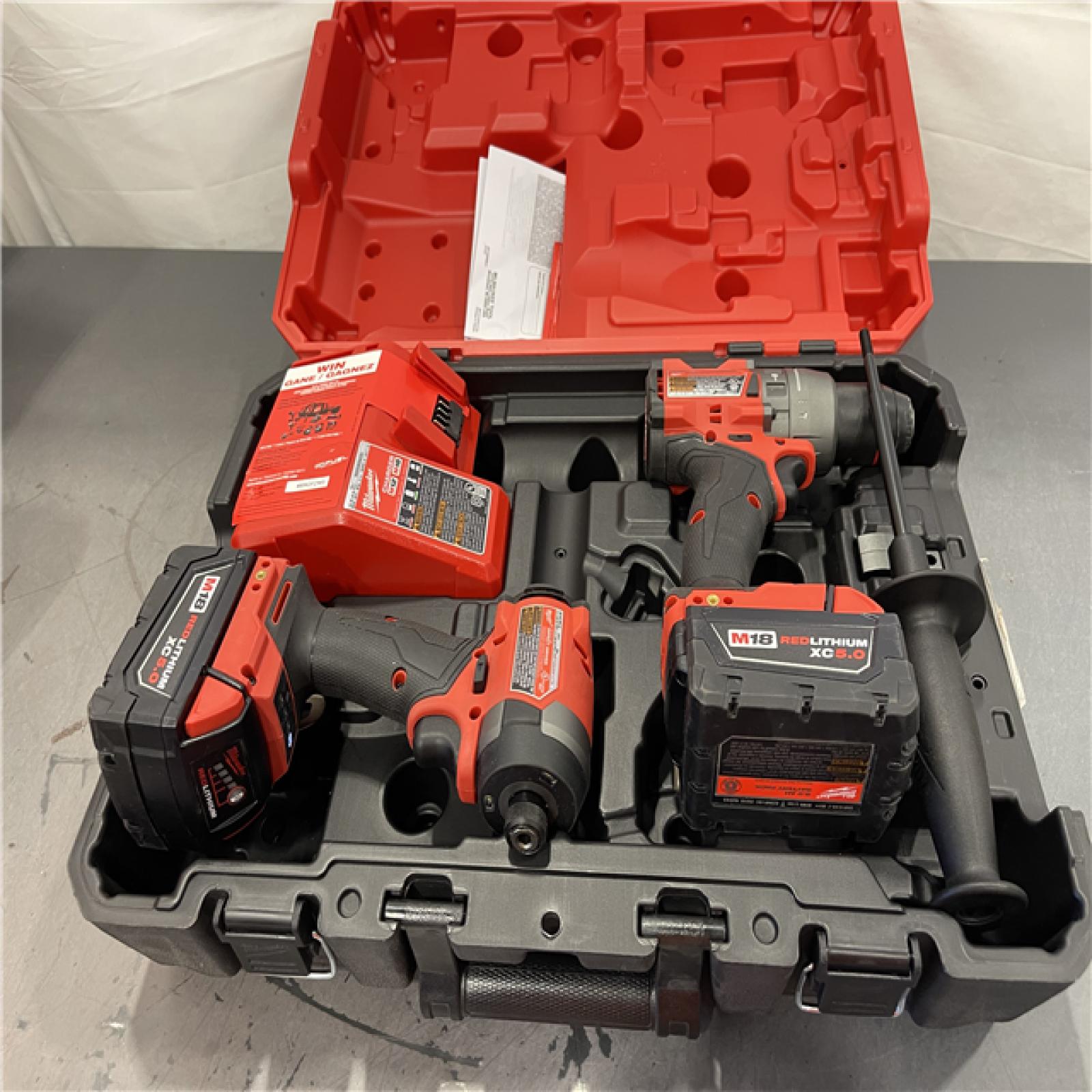AS-IS - Milwaukee M18 FUEL 18V Lithium-Ion Brushless Cordless Hammer Drill and Impact Driver Combo Kit