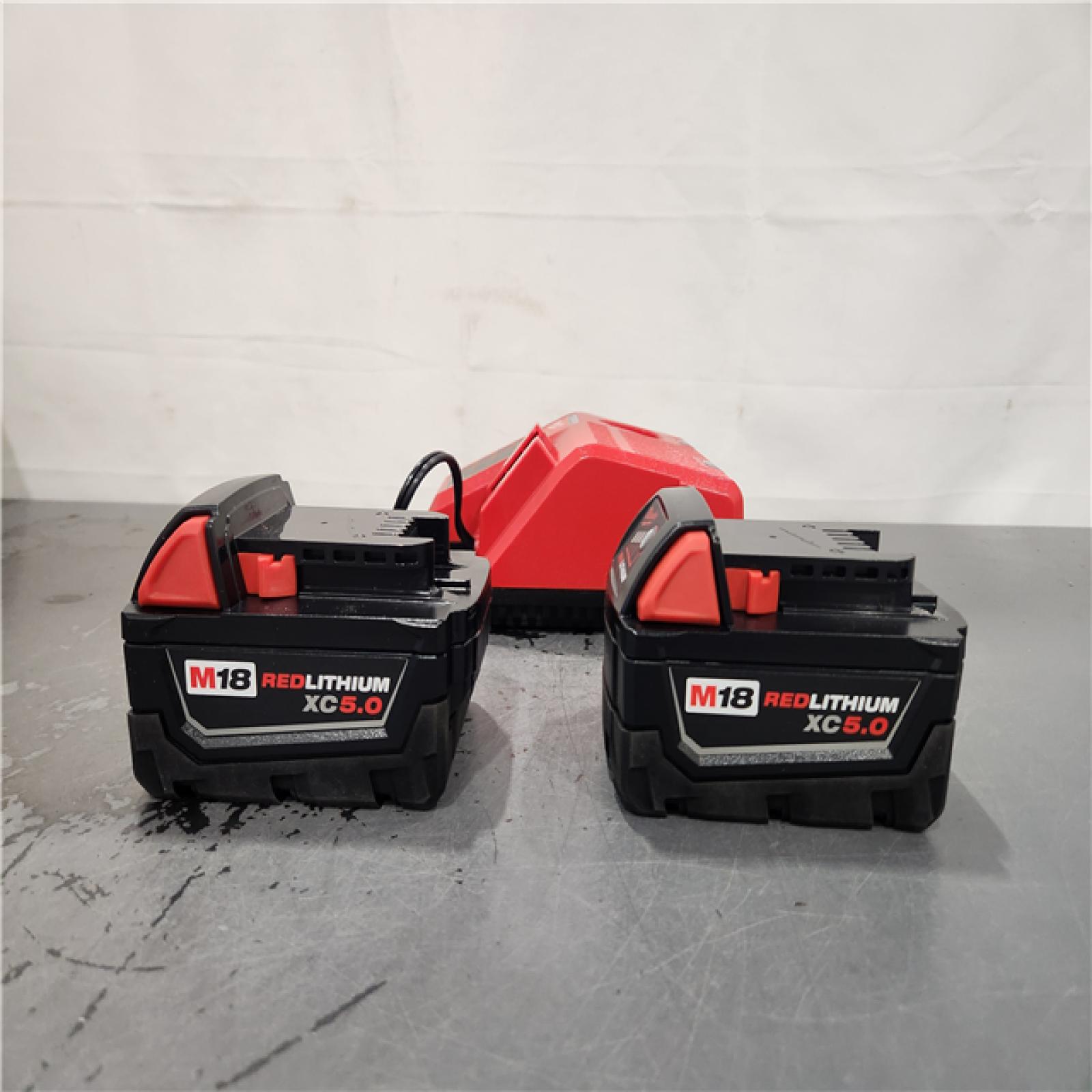 AS-IS- Milwaukee M18 18-Volt Lithium-Ion XC Starter Kit with Two 5.0Ah Batteries and Charger
