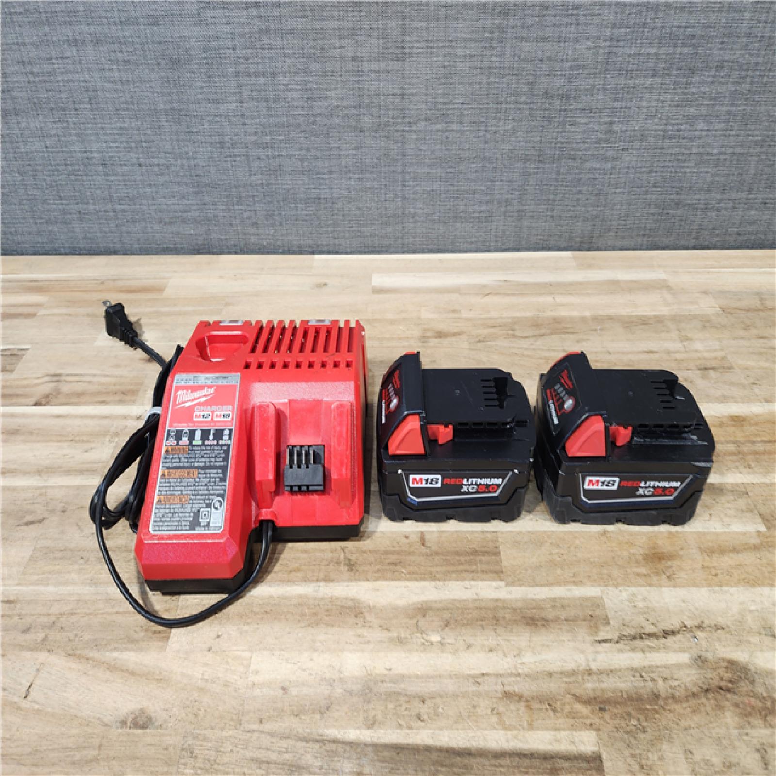 HOUSTON LOCATION - AS-IS MILWAUKEE 2 TOOL COMBO KIT W/ (2) BATTERY & CHARGER