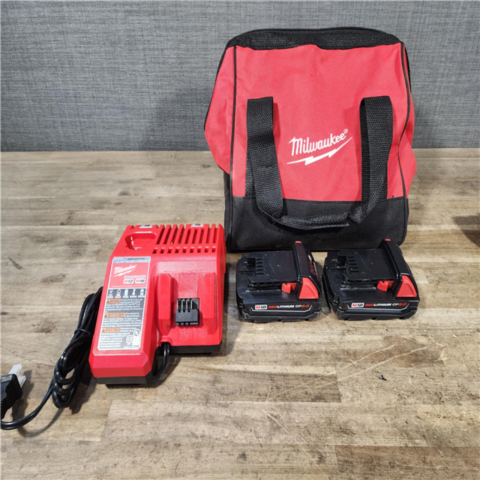 HOUSTON LOCATION - AS-IS Milwaukee M18 18V Lithium-Ion Brushless Cordless Compact Drill/Impact Combo Kit (2-Tool) W/(2) 2.0 Ah Batteries  Charger & Bag