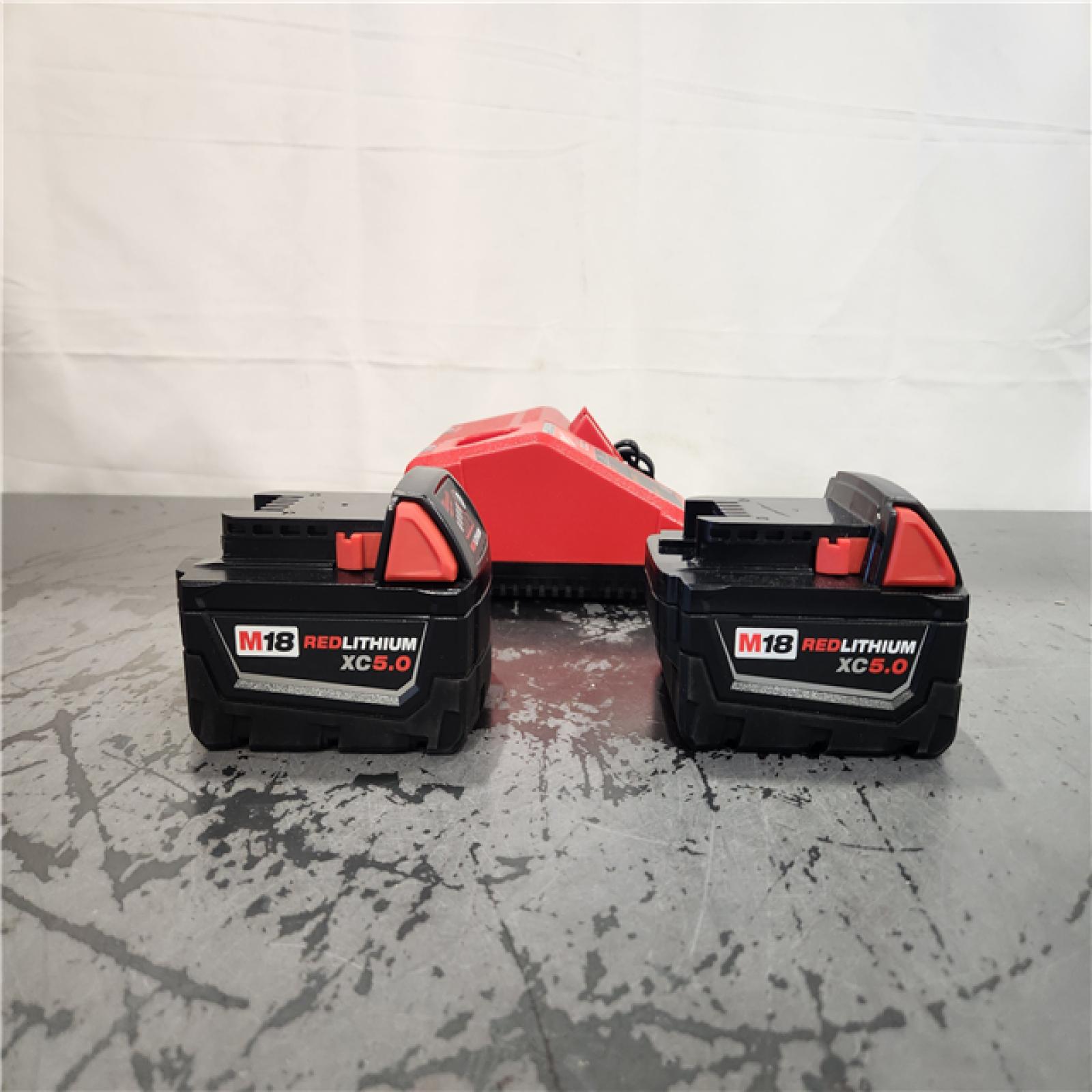 AS-IS- Milwaukee 18-Volt Lithium-Ion XC Starter Kit with Two 5.0Ah Batteries and Charger