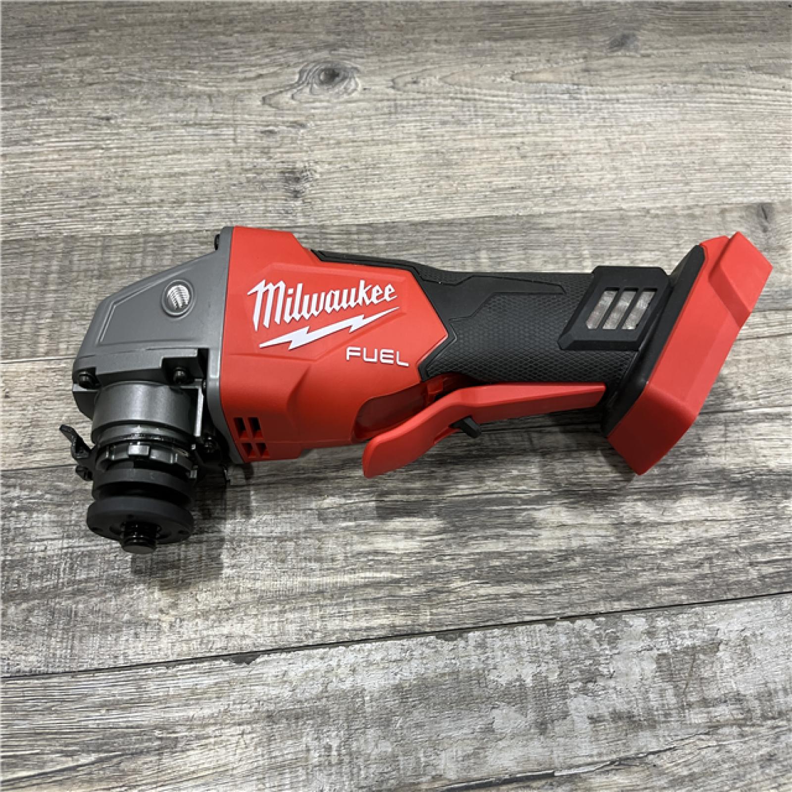 AS-IS Milwaukee FUEL 18V Lithium-Ion Brushless Cordless 4-1/2 in./5 in. Grinder w/Paddle Switch (Tool-Only)