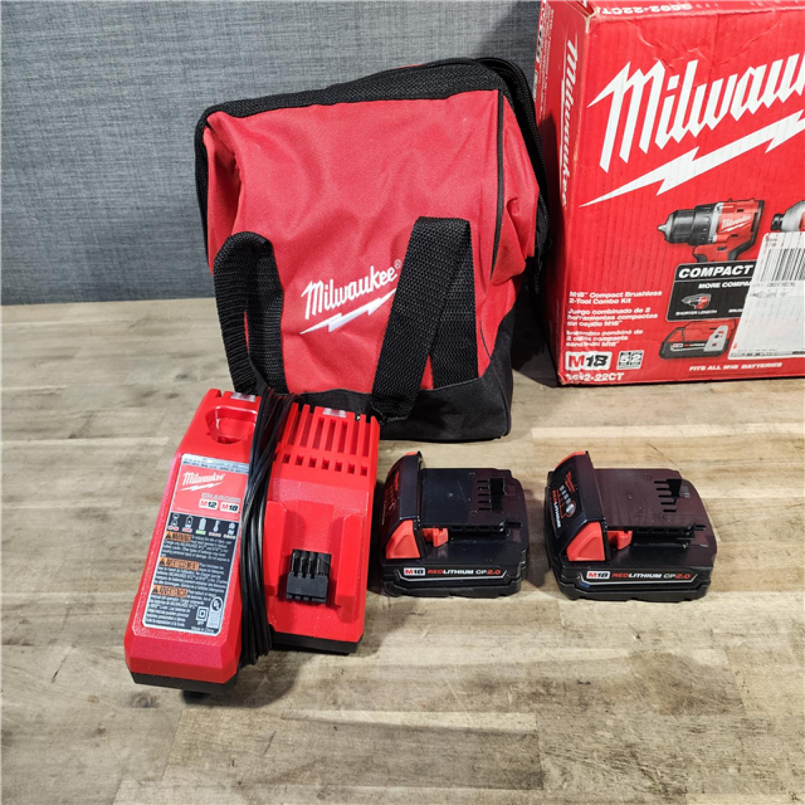 HOUSTON LOCATION - AS-IS Milwaukee M18 18V Lithium-Ion Brushless Cordless Compact Drill/Impact Combo Kit (2-Tool) W/(2) 2.0 Ah Batteries, Charger & Bag