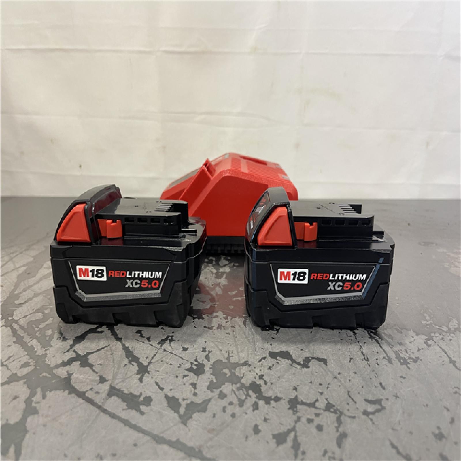 AS-IS- Milwaukee M18 18-Volt Lithium-Ion XC Starter Kit with Two 5.0Ah Batteries and Charger