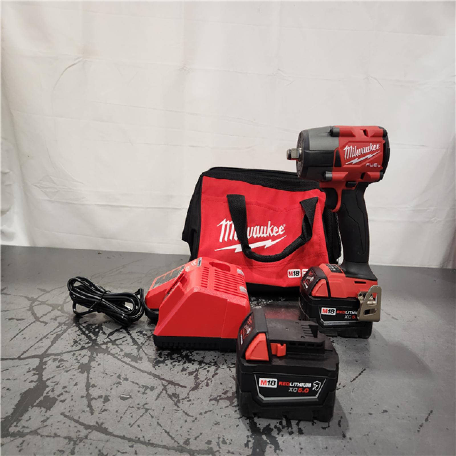 AS-IS- Milwaukee M18 FUEL 1/2 in. Cordless Brushless Mid-Torque Impact Wrench Kit (Battery & Charger)