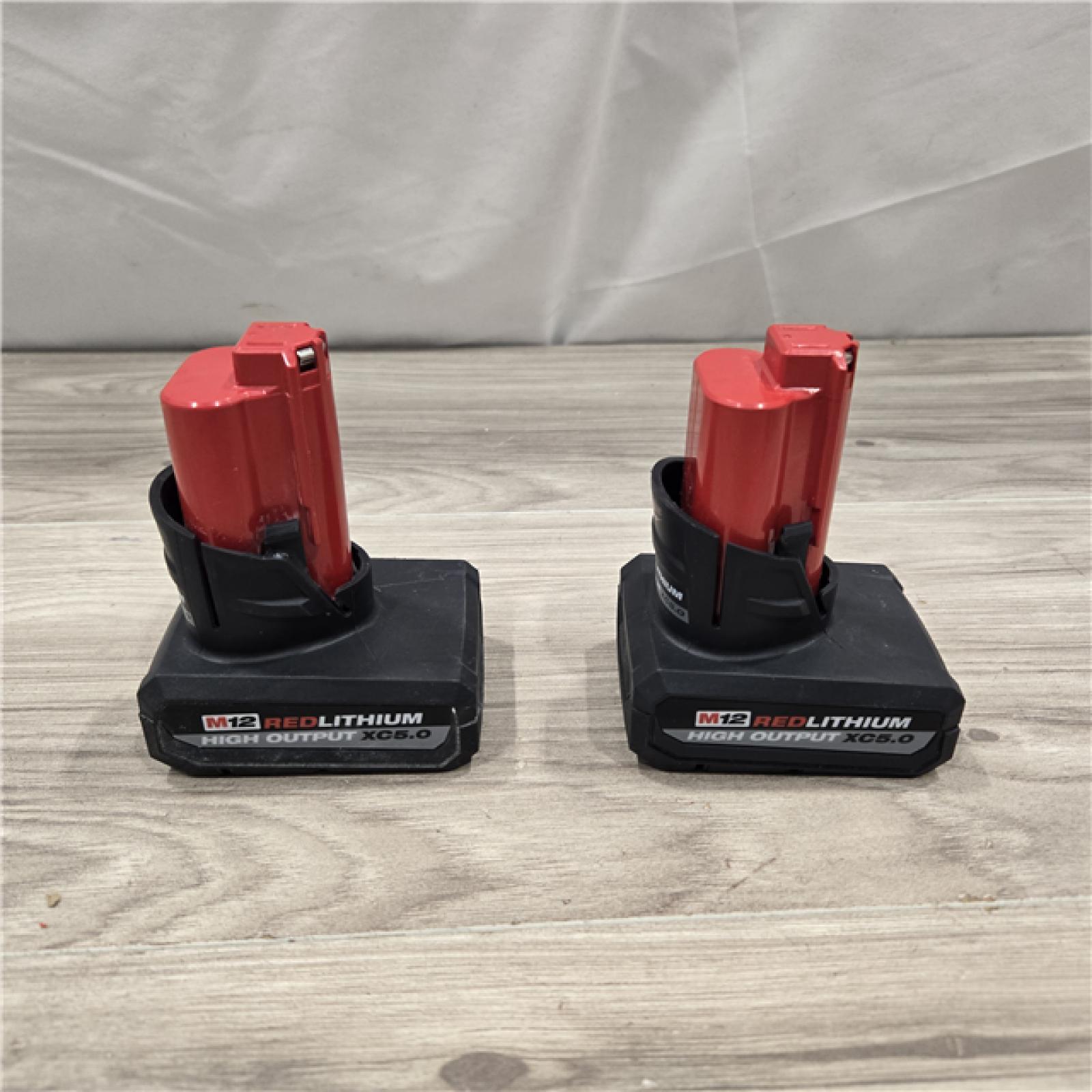 AS-IS Milwaukee M12 12V Lithium-Ion XC High Output 5.0 Ah Battery Pack (2-Pack) Starter Kit