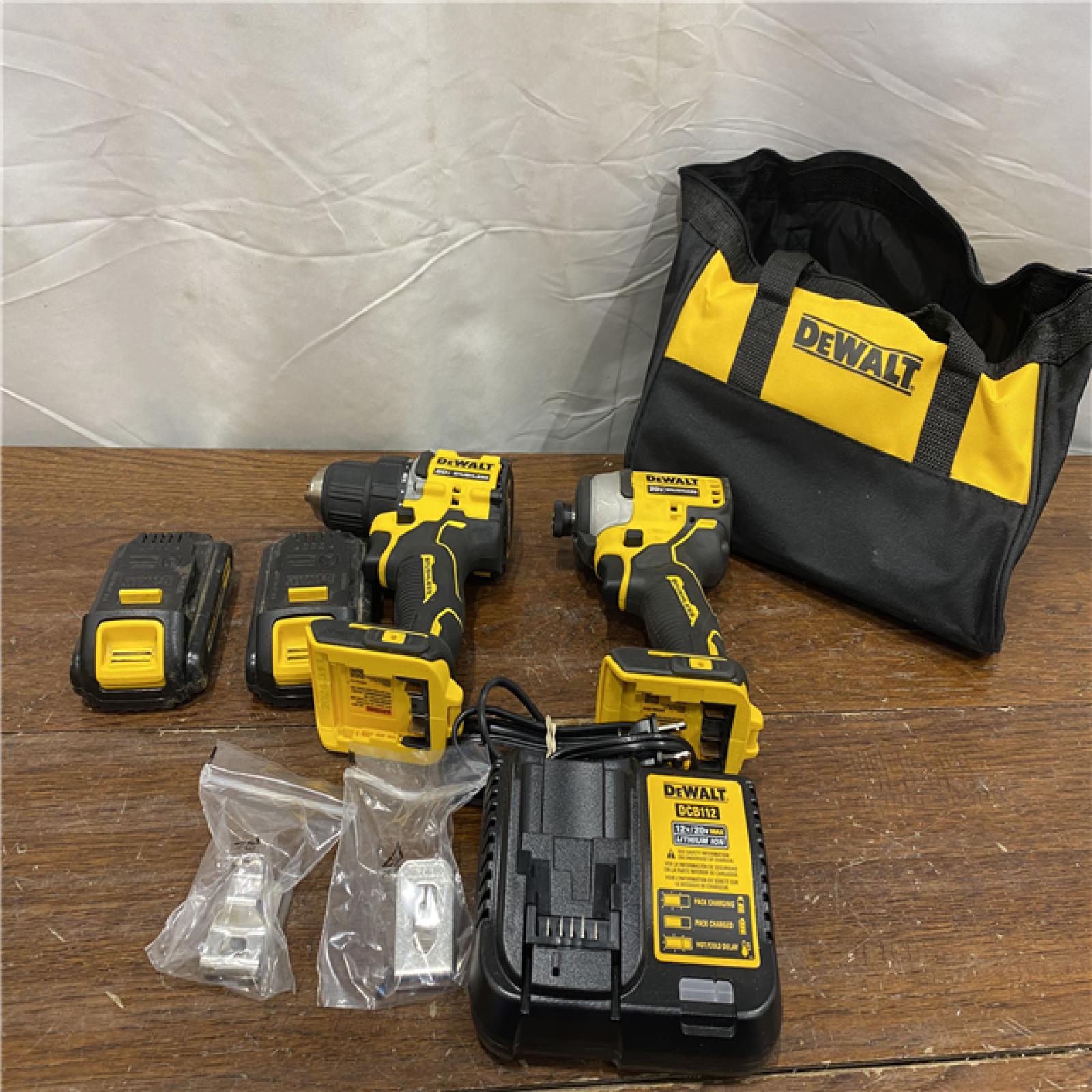 AS-IS Dewalt DCK225D2 20V MAX ATOMIC Brushless Compact Lithium-Ion 1/2 in. Cordless Drill Driver and 1/4 in. Impact Driver Combo Kit with 2 Batteries 2 Ah