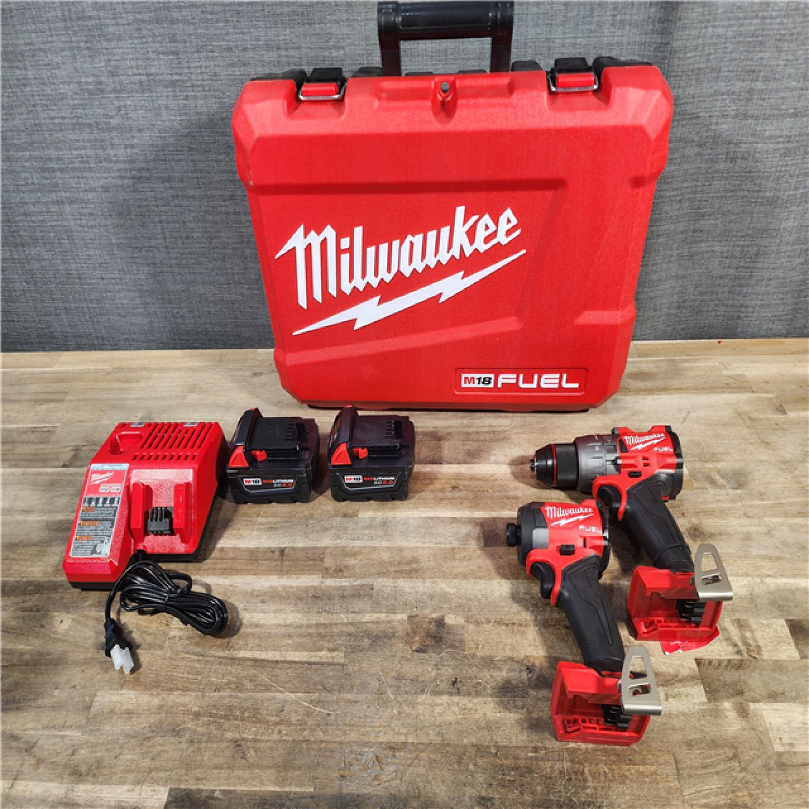 HOUSTON LOCATION - AS-IS (APPEARS LIKE NEW) MILWAUKEE FUEL 18V Lithium-Ion Brushless Cordless Hammer Drill and Impact Driver Combo Kit (2-Tool) with 2 Batteries