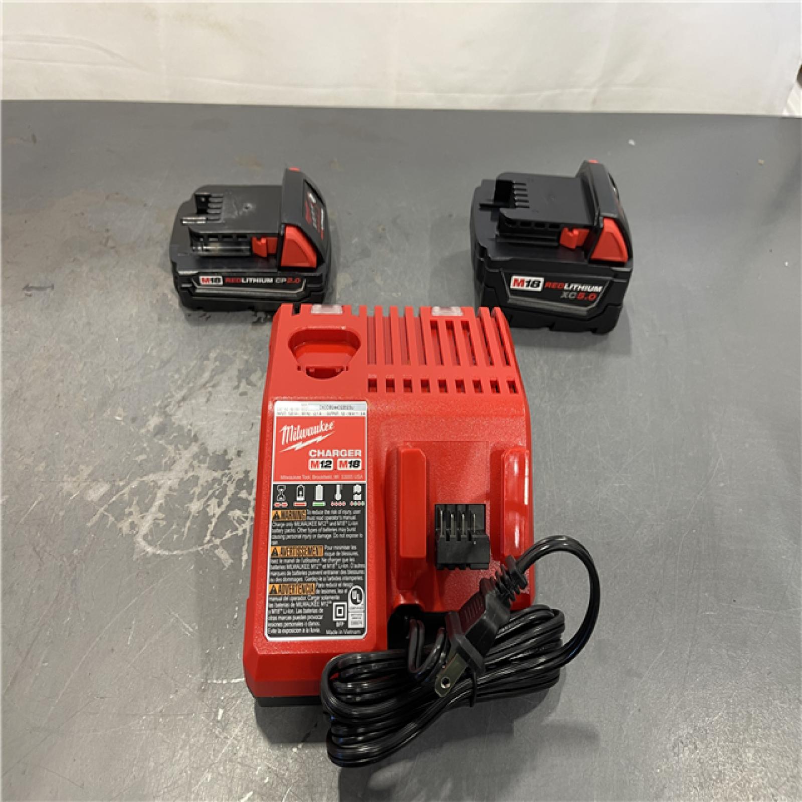 AS-IS - Milwaukee M18 18-Volt Lithium-Ion Starter Kit with One 5.0 Ah and One 2.0 Ah Battery and Charger