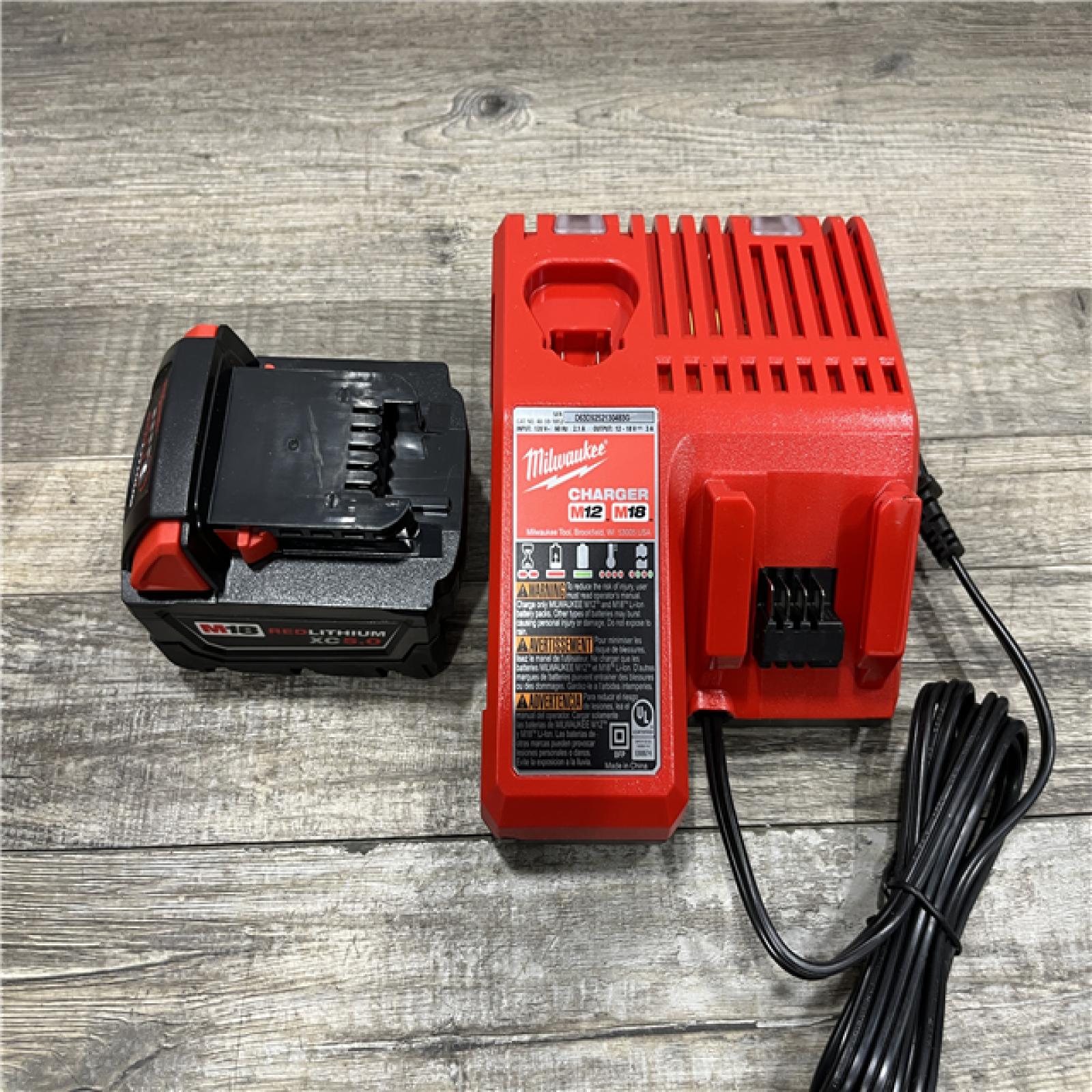 AS-IS Milwaukee 18-Volt Lithium-Ion XC Starter Kit with One 5.0Ah Battery and Charger