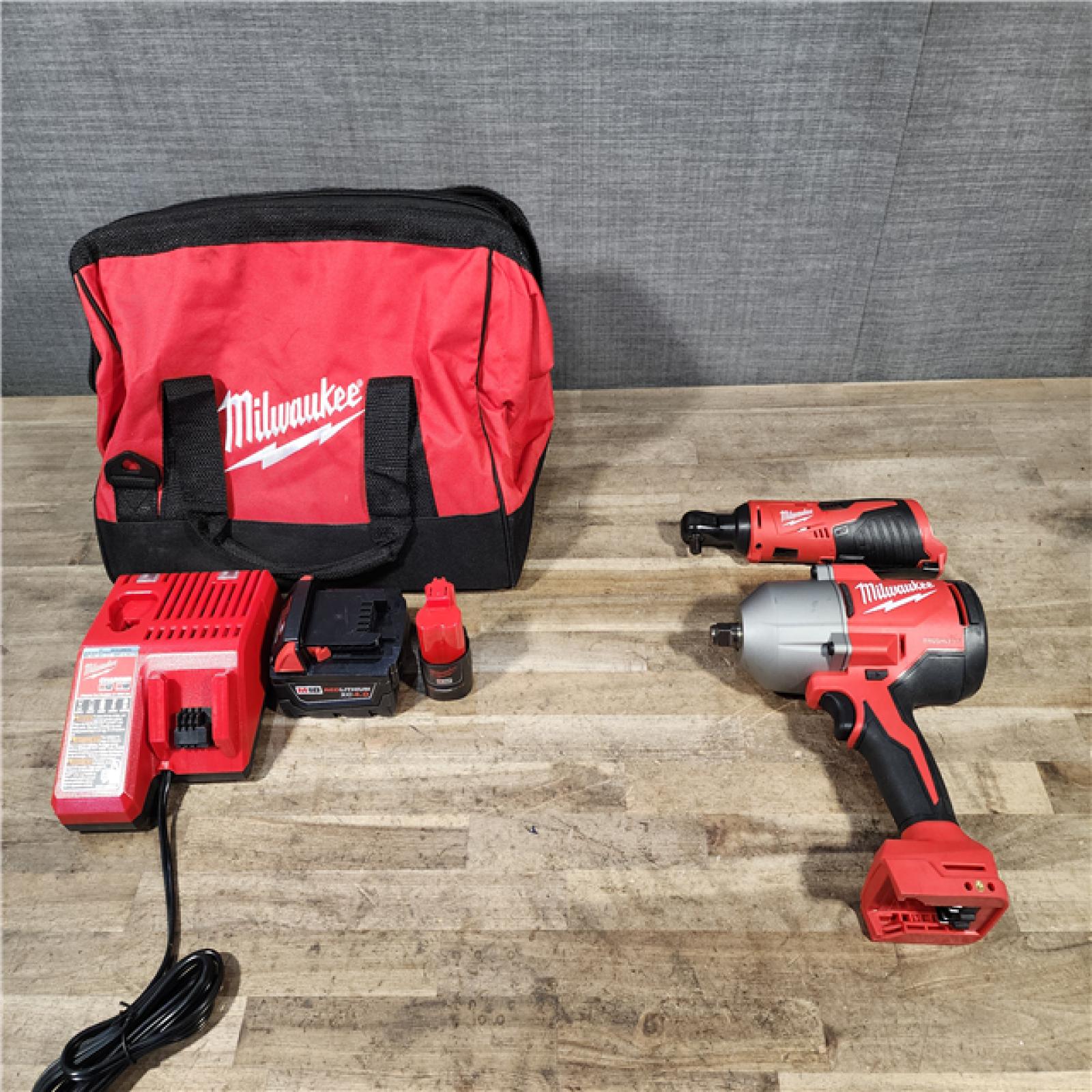 HOUSTON LOCATION - AS-IS Milwaukee 12/18V Lithium-Ion Cordless 3/8 in. Ratchet and 1/2 in. High Torque Impact Wrench with Friction Ring Combo Kit